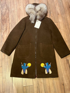 Vintage Inuvik Enterprise brown 100% pure virgin wool northern parka with zipper closure, front pockets, fur trimmed hood and felt applique in a drumming motif.

Made in Canada
Chest 38”
