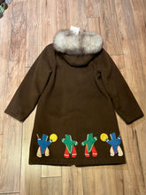 Load image into Gallery viewer, Vintage Inuvik Enterprise brown 100% pure virgin wool northern parka with zipper closure, front pockets, fur trimmed hood and felt applique in a drumming motif.

Made in Canada
Chest 38”
