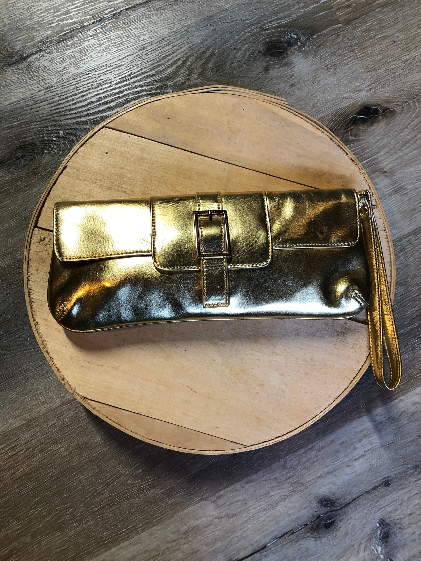 Kingspier Vintage - Danier gold leather flap clutch with magnetic buckle closure, inside zip pocket and wrist strap.
