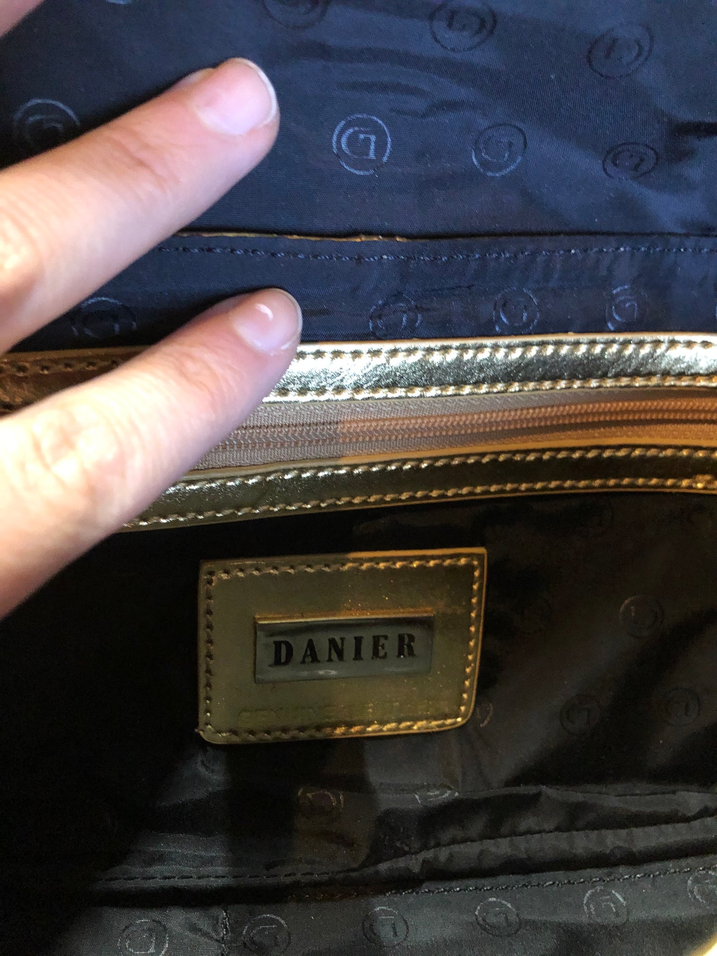 Kingspier Vintage - Danier gold leather flap clutch with magnetic buckle closure, inside zip pocket and wrist strap.