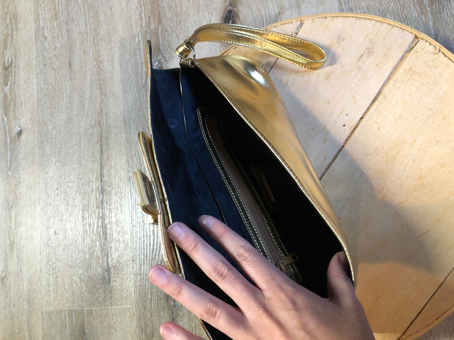 Kingspier Vintage - Danier gold leather flap clutch with magnetic buckle closure, inside zip pocket and wrist strap.