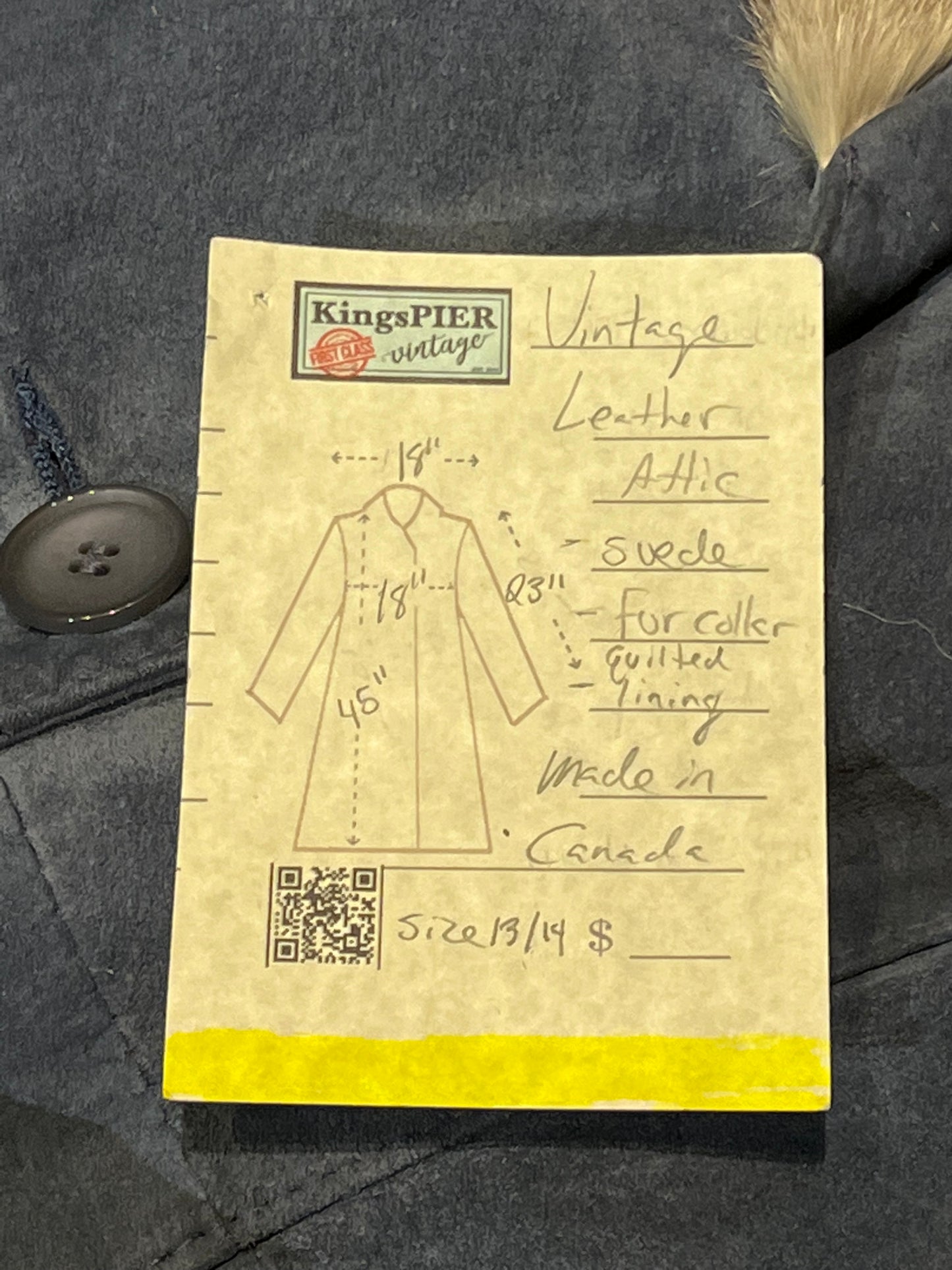 Vintage Leather Attic long blue/grey suede coat with white fur collar, belt, two front pockets, button closures and a quilted lining.
Made in Canada, Size 13/14