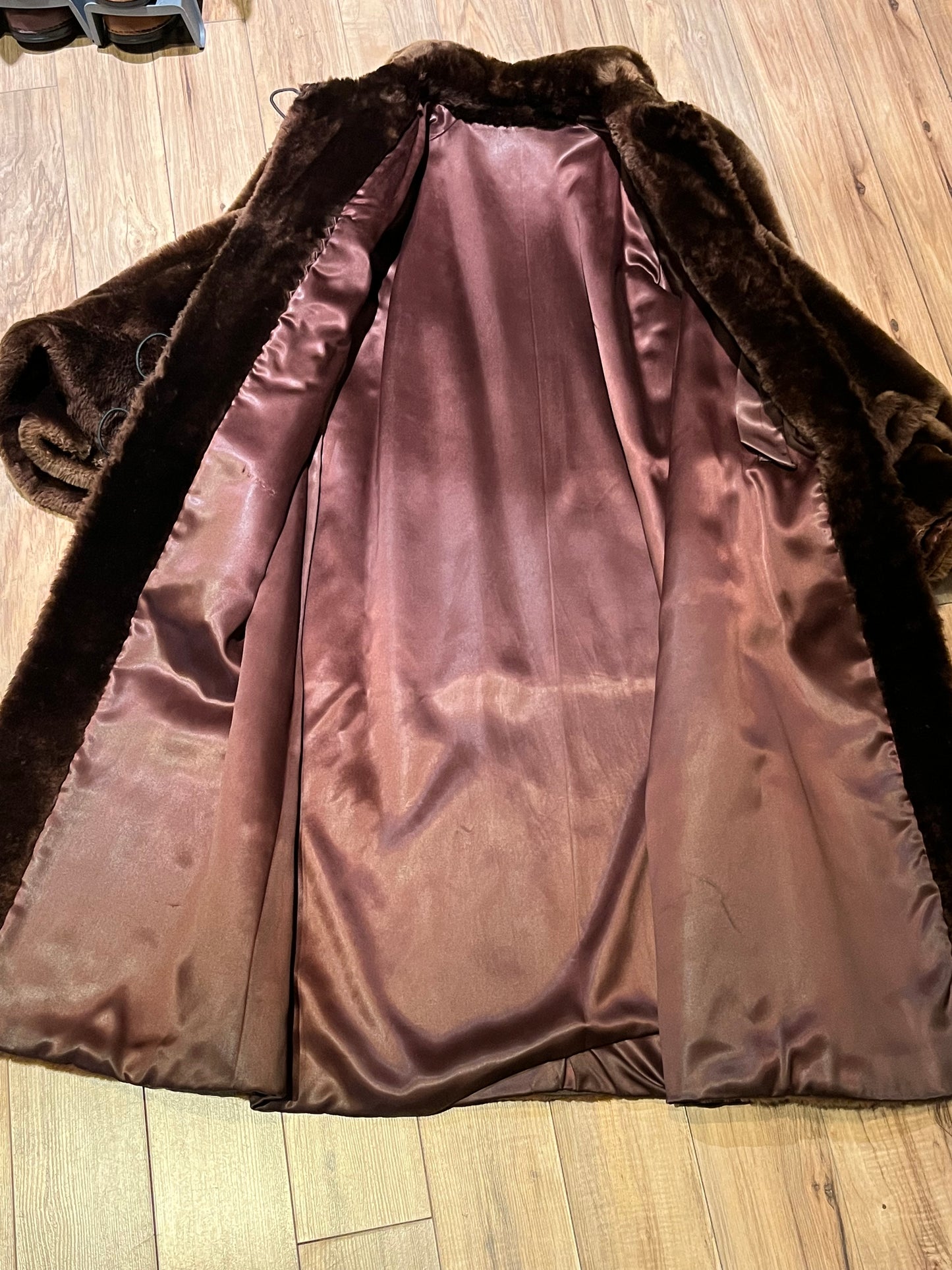 Vintage shorn beaver long fur coat with two front pockets, one inside pocket balloon sleeves and flower decorated button closures.
Chest 42”