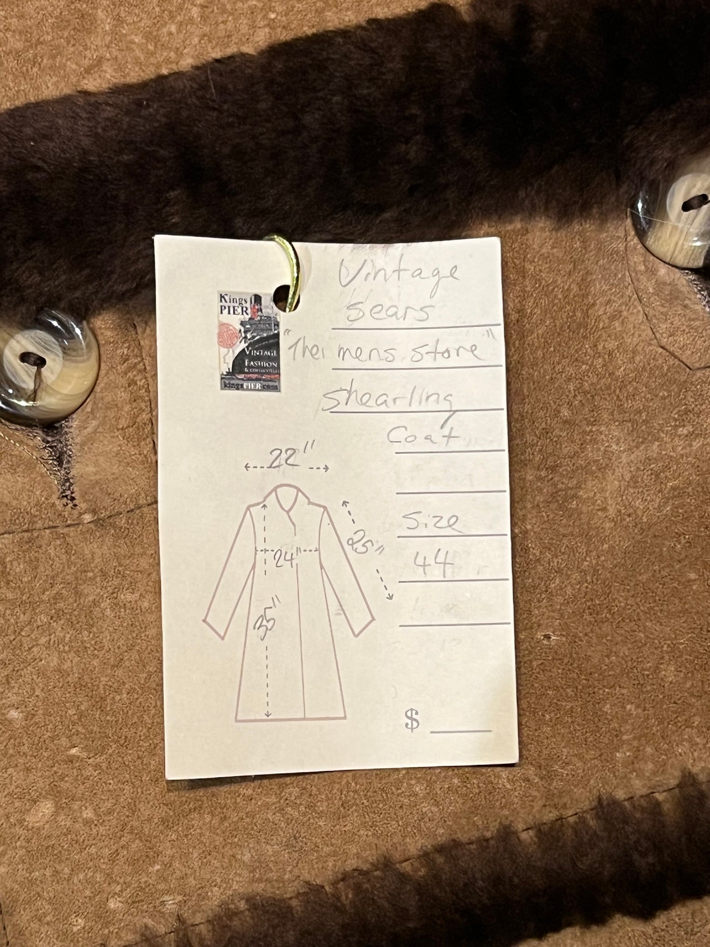 Vintage Sears “The Mens Store” shearling coat with two front pockets and button closures.
Size 44