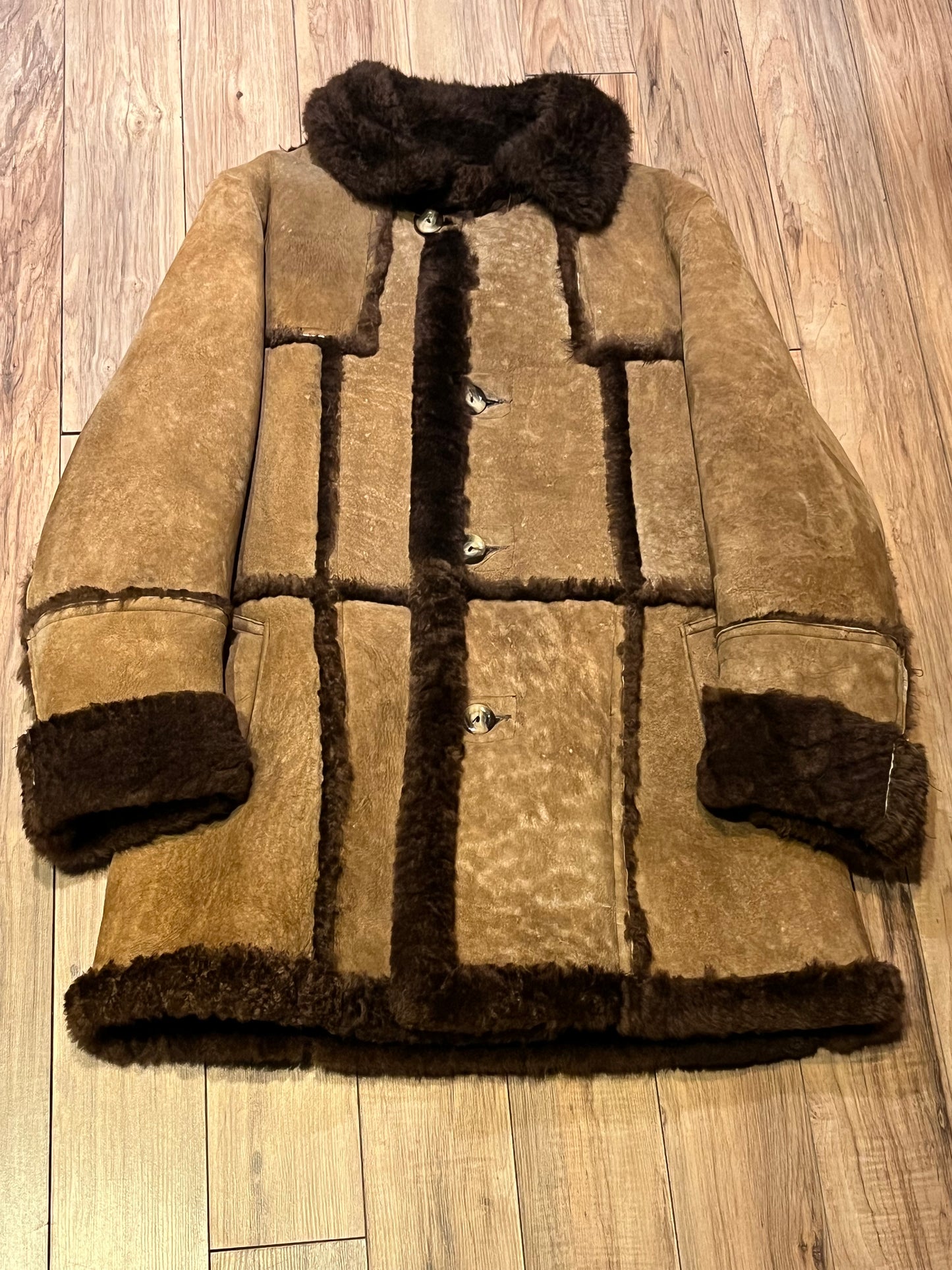 Vintage Sears “The Mens Store” shearling coat with two front pockets and button closures.
Size 44