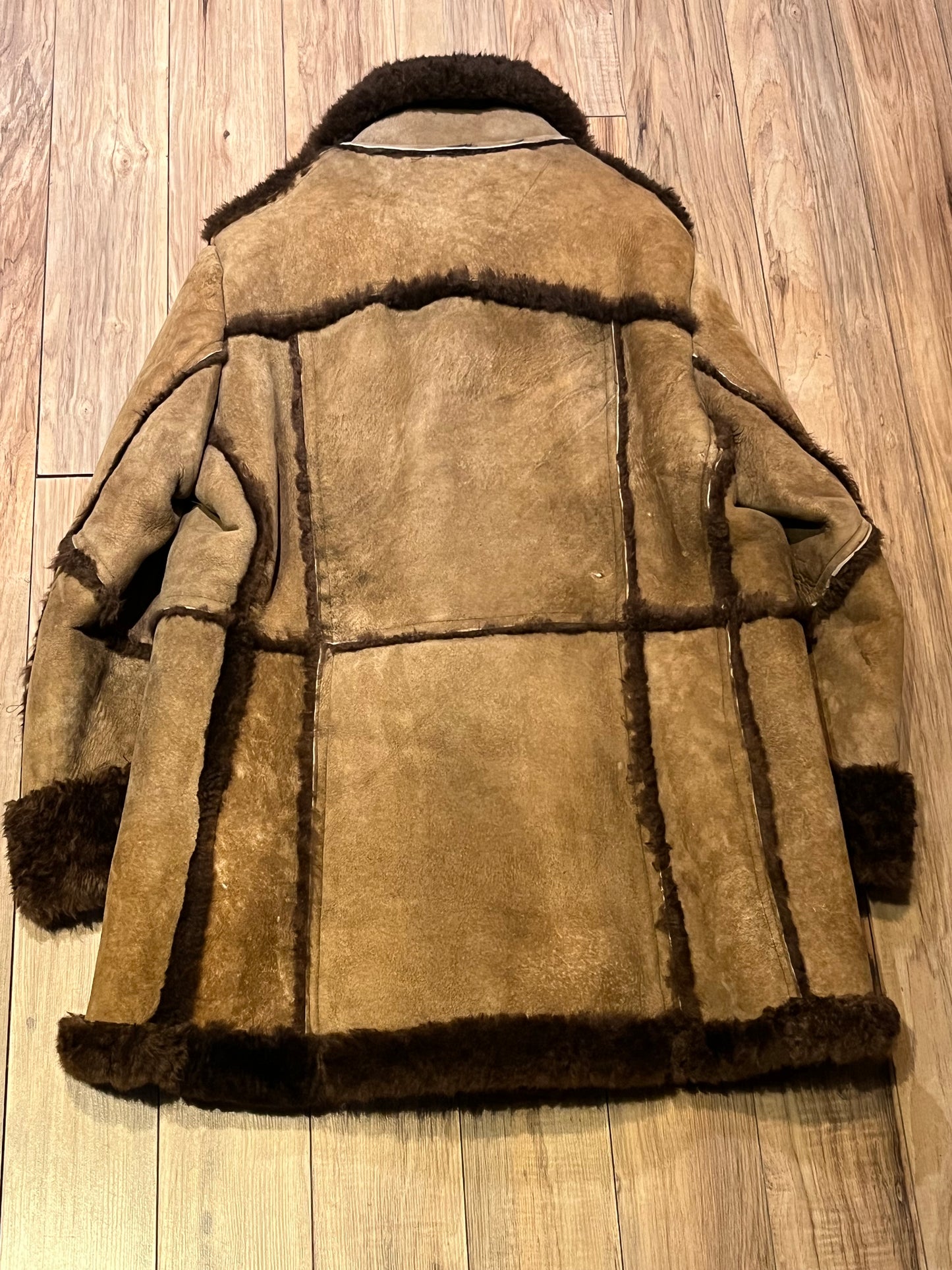 Vintage Sears “The Mens Store” shearling coat with two front pockets and button closures.
Size 44