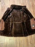 Vintage Sears “The Mens Store” shearling coat with two front pockets and button closures.
Size 44