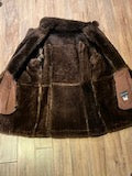 Load image into Gallery viewer, Vintage Sears “The Mens Store” shearling coat with two front pockets and button closures.

Size 44
