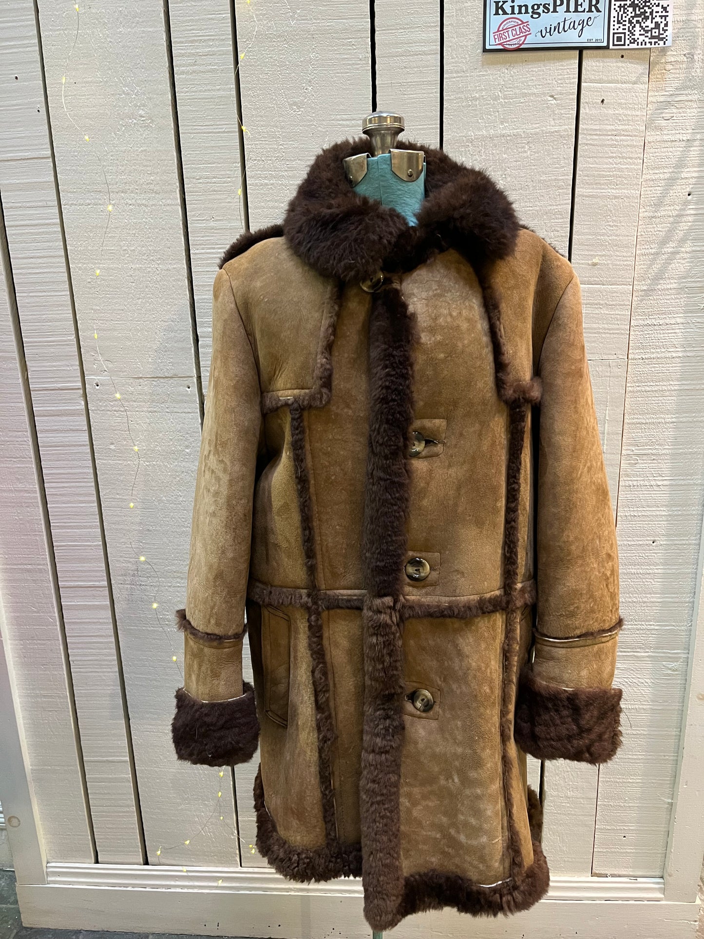 Vintage Sears “The Mens Store” shearling coat with two front pockets and button closures.
Size 44