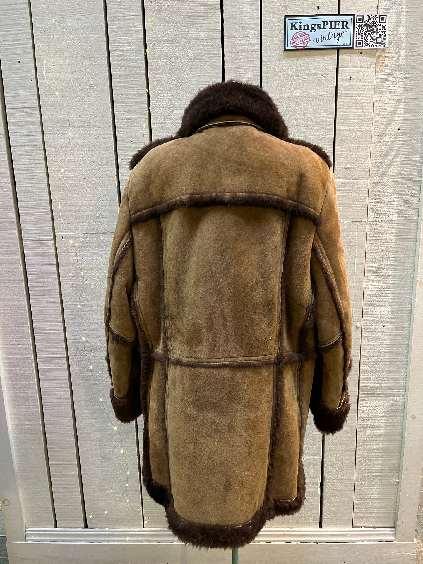 Vintage Sears “The Mens Store” shearling coat with two front pockets and button closures.
Size 44