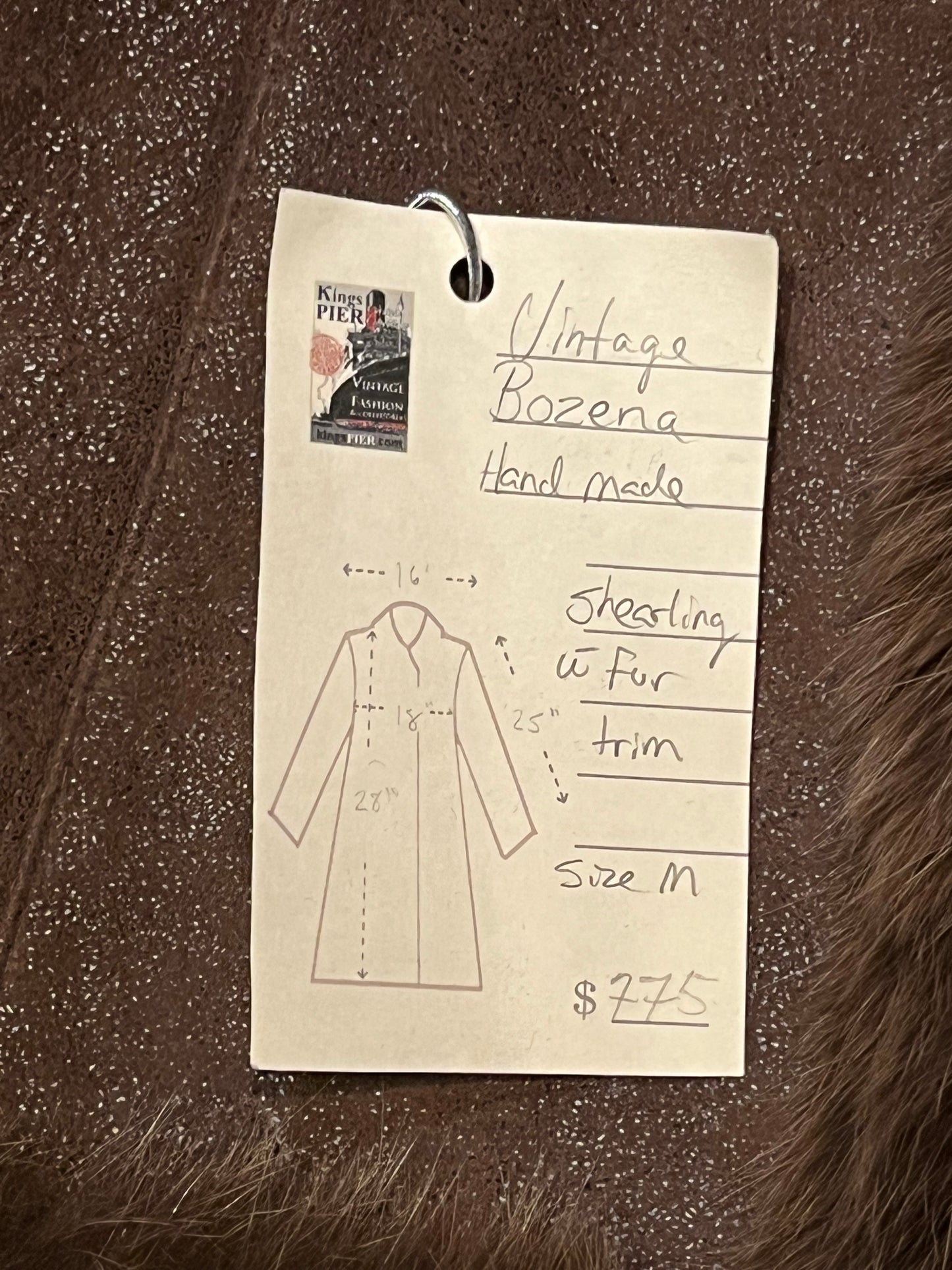Vintage Bozena hand-made brown shearling coat with fur trim, toggle closures and two front pockets.
Size Medium