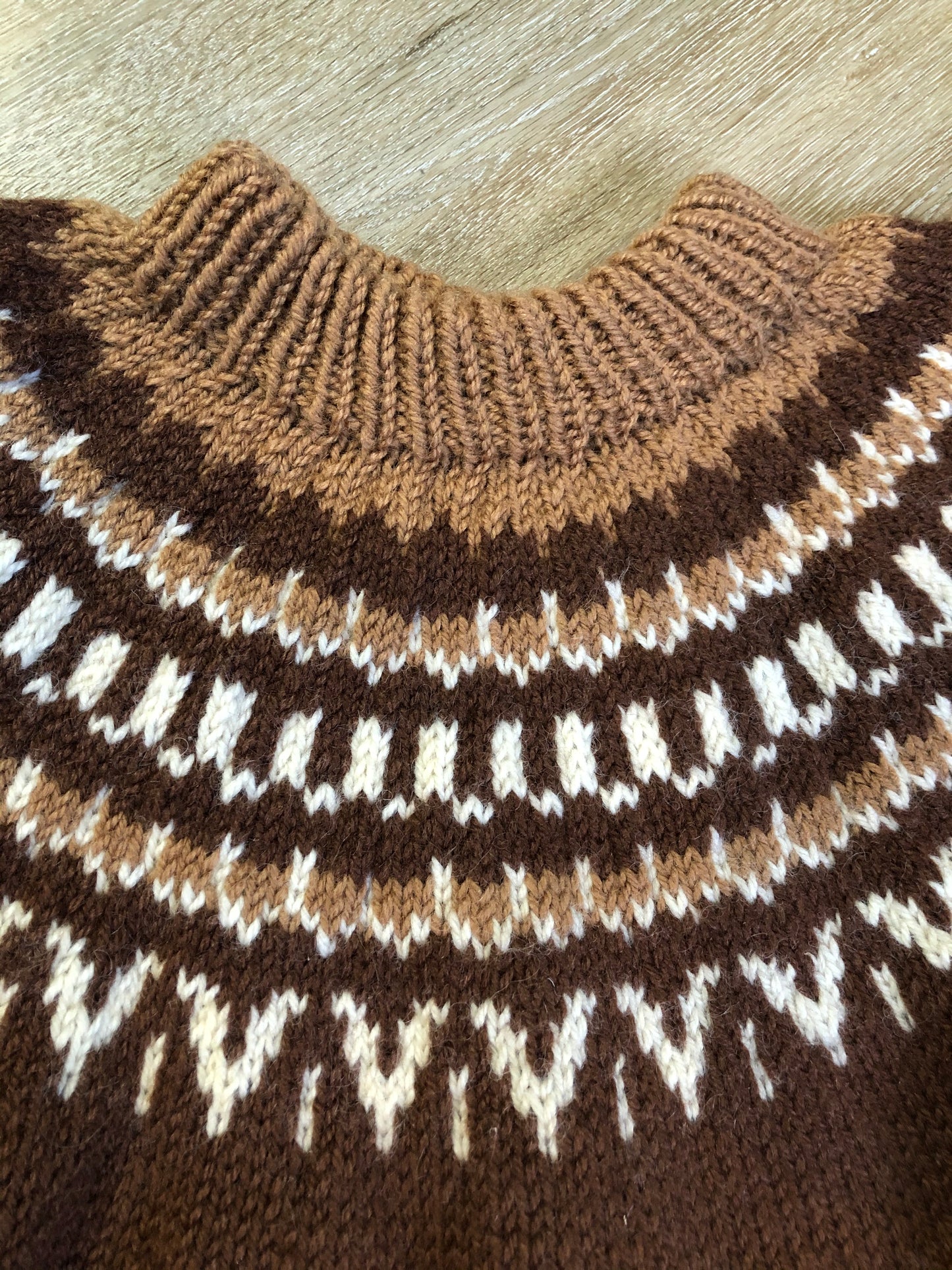Kingspier Vintage - Handknit lopi sweater with warm brown and white design. Fibres unknown. Made in Nova Scotia, Canada. Size medium.