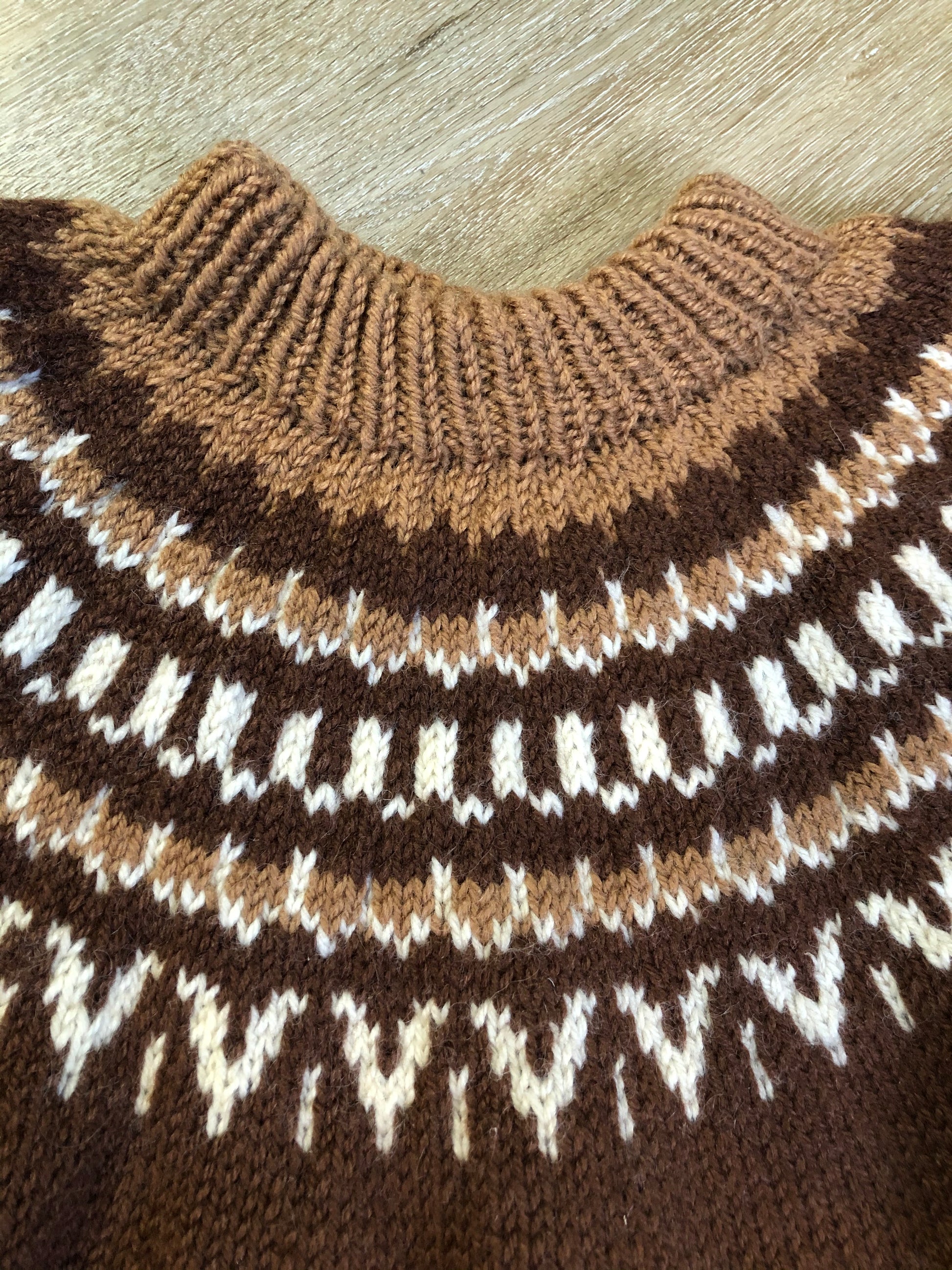 Kingspier Vintage - Handknit lopi sweater with warm brown and white design. Fibres unknown. Made in Nova Scotia, Canada. Size medium.