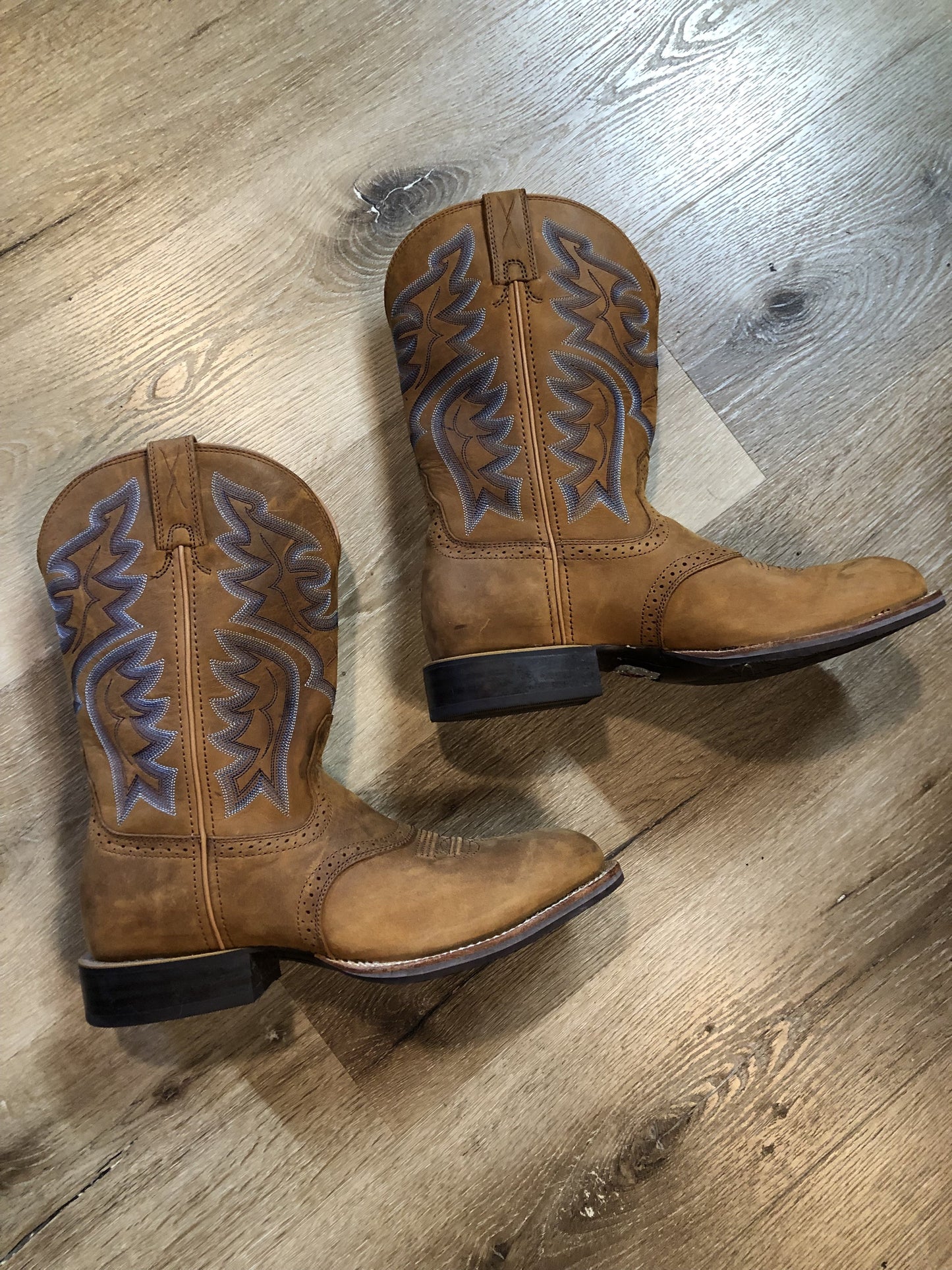 Twisted leather light brown cowboy boots with blue decorative stitching, leather lined with synthetic soles. Size 10M, 12W US/ 43 EUR