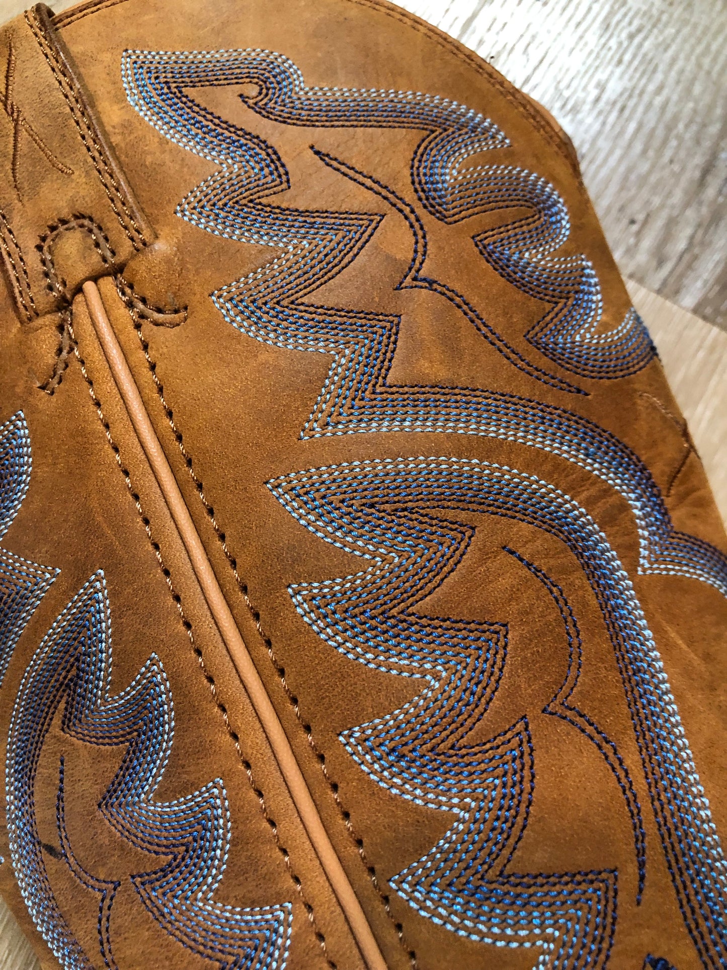 Twisted leather light brown cowboy boots with blue decorative stitching, leather lined with synthetic soles. Size 10M, 12W US/ 43 EUR