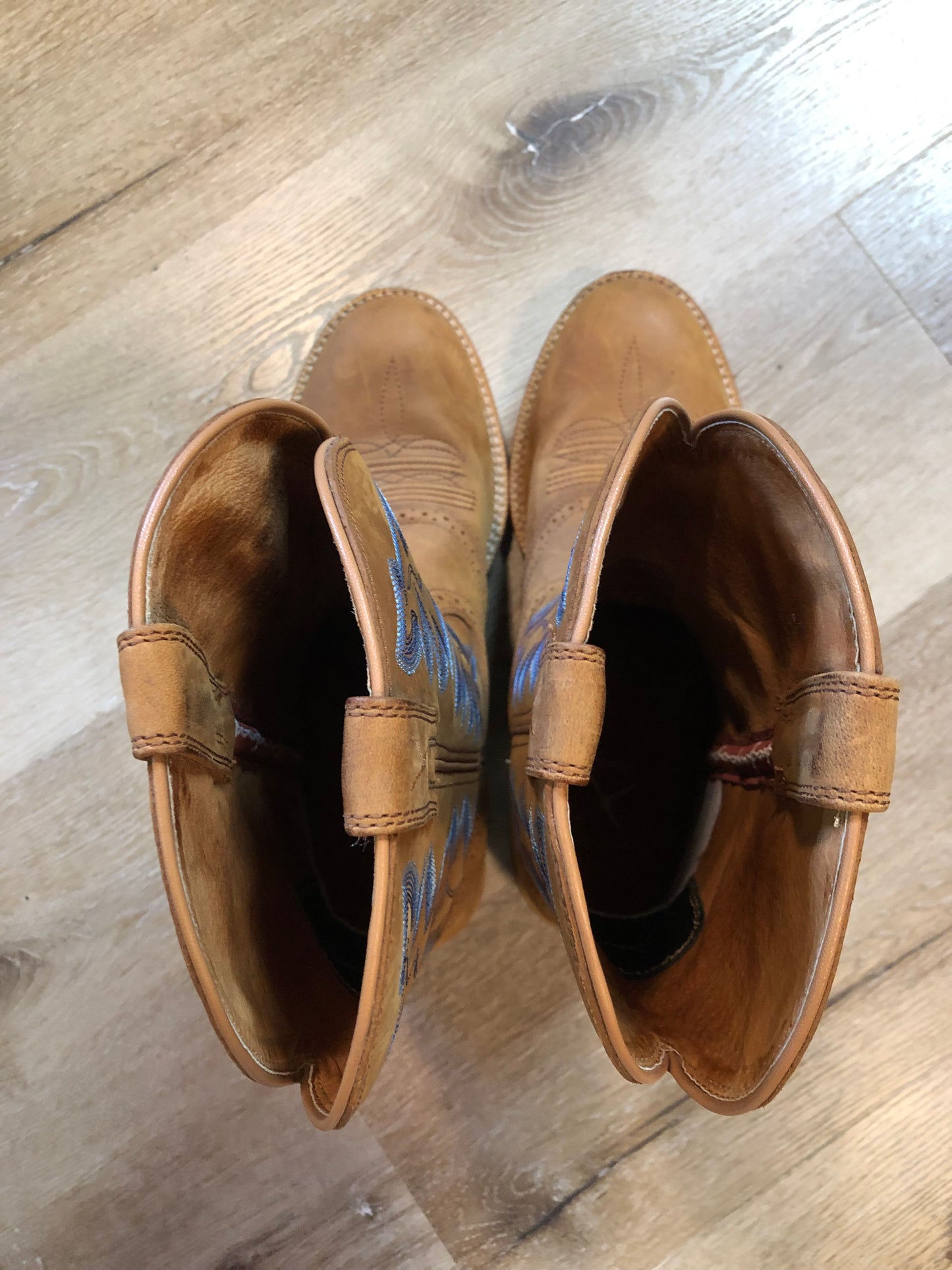 Twisted leather light brown cowboy boots with blue decorative stitching, leather lined with synthetic soles. Size 10M, 12W US/ 43 EUR