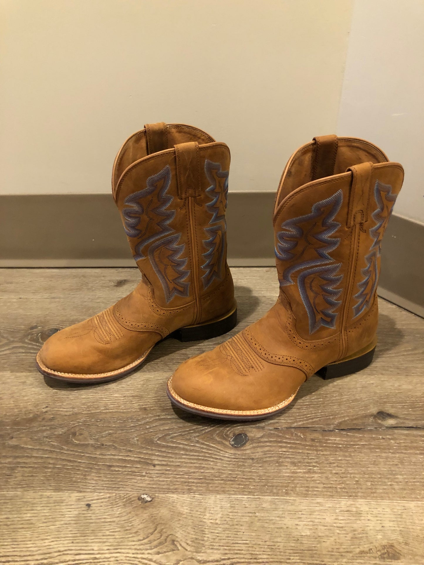 Twisted leather light brown cowboy boots with blue decorative stitching, leather lined with synthetic soles. Size 10M, 12W US/ 43 EUR