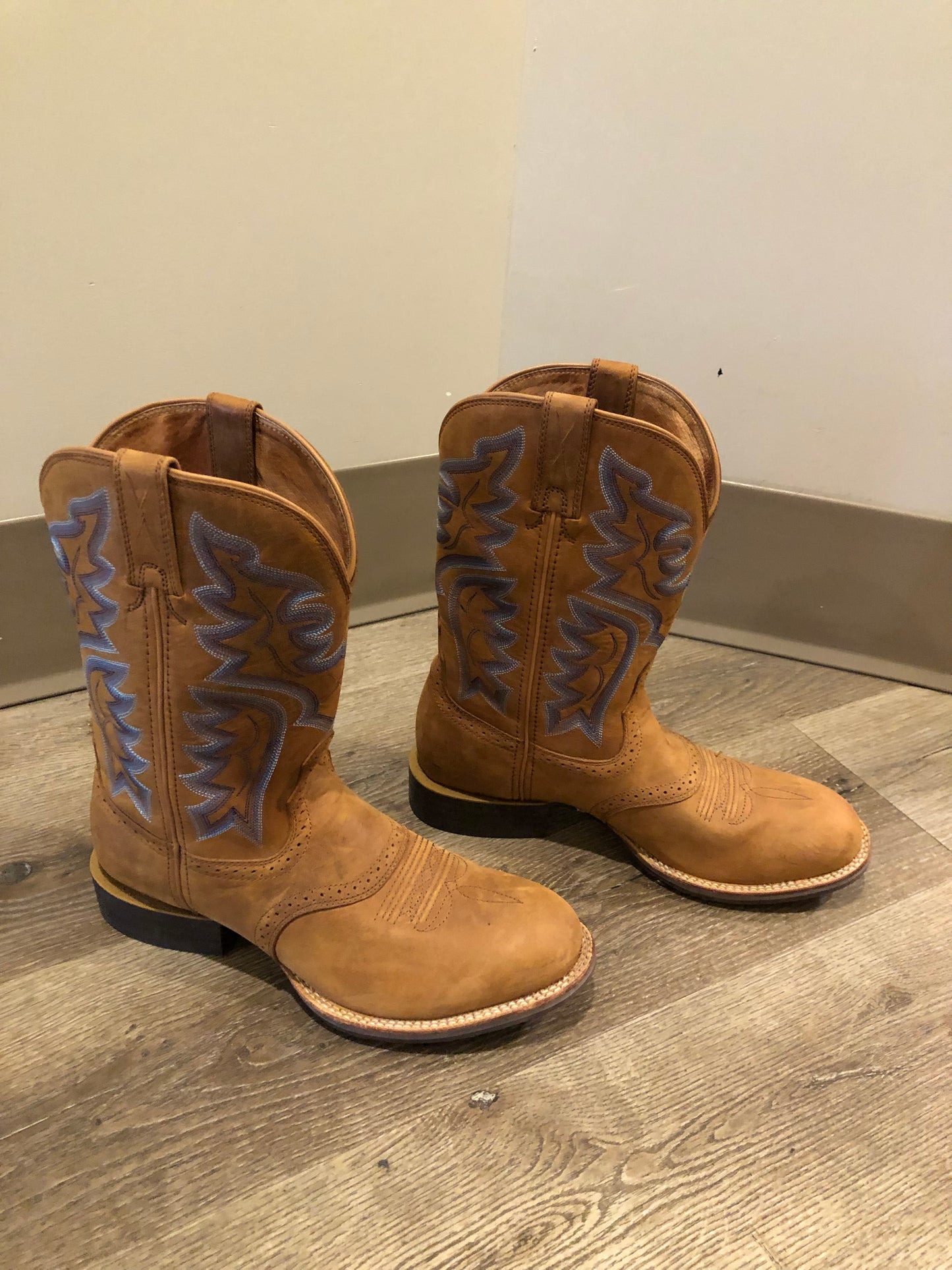 Twisted leather light brown cowboy boots with blue decorative stitching, leather lined with synthetic soles. Size 10M, 12W US/ 43 EUR