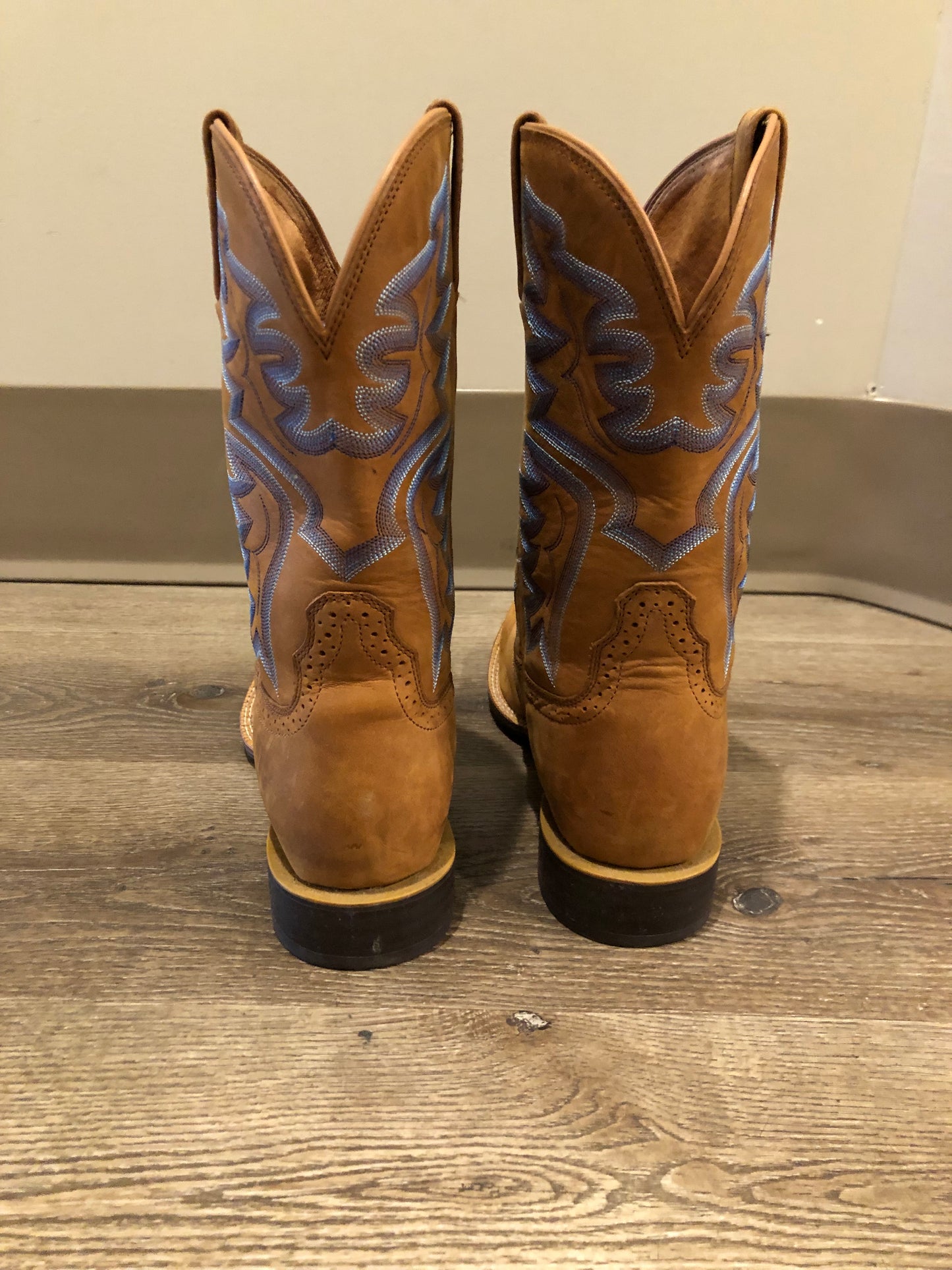 Twisted leather light brown cowboy boots with blue decorative stitching, leather lined with synthetic soles. Size 10M, 12W US/ 43 EUR