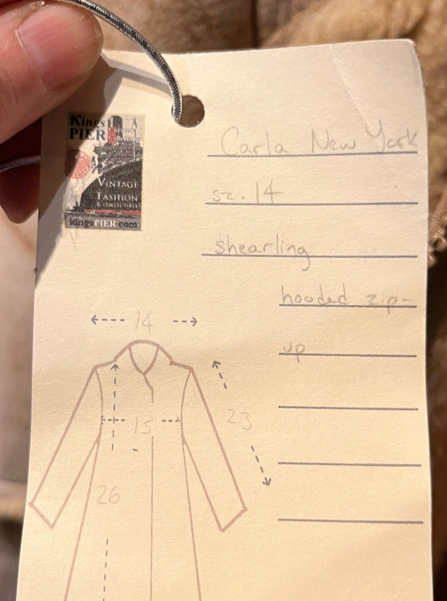 Vintage Carla New York shearling coat with hood, two front pockets and a zipper closure.
Chest 30”