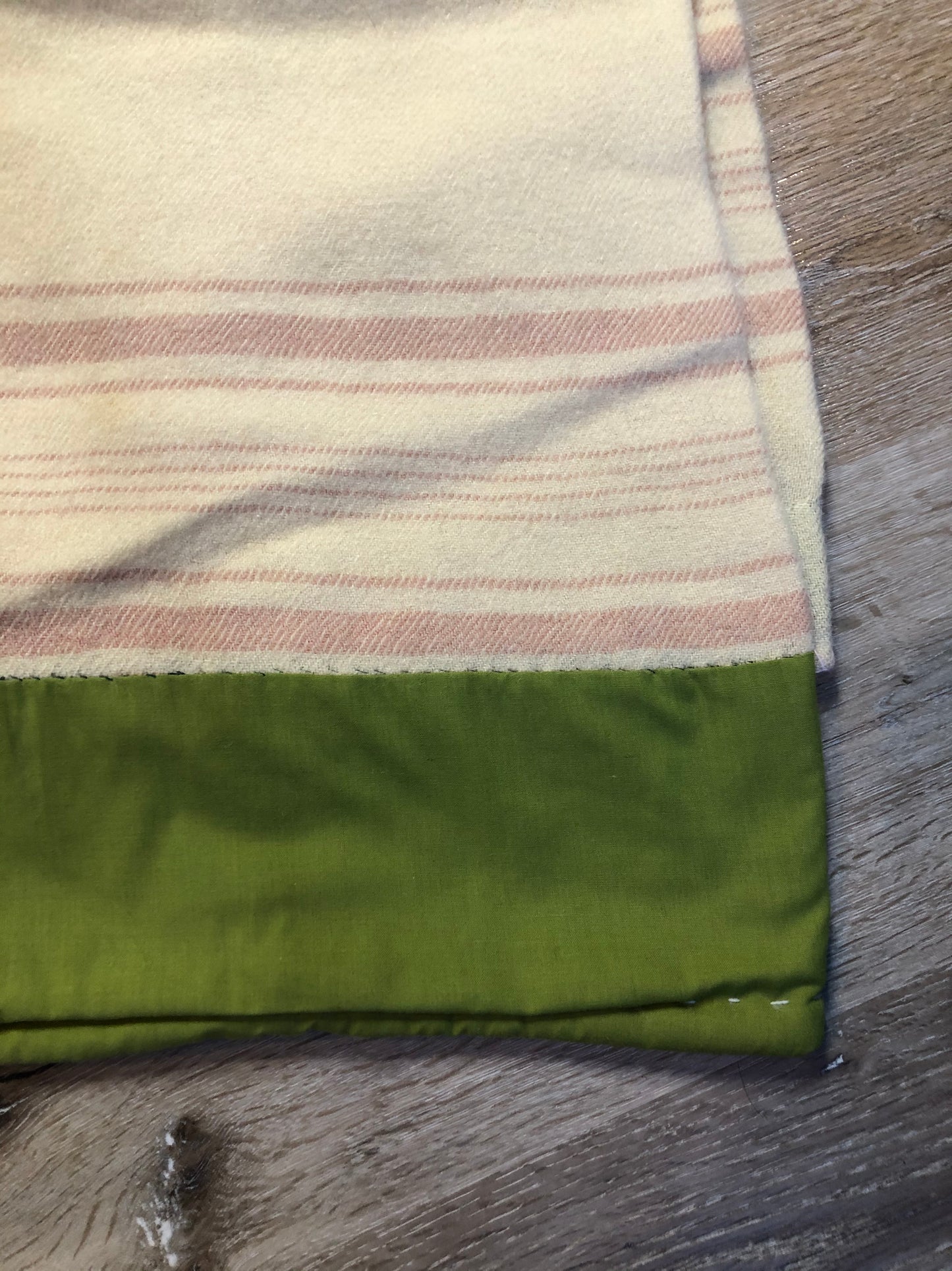 Kingspier Vintage - Vintage Boswell beige and pink stripe wool lap blanket with green reinforcement on the back of the ribbon.