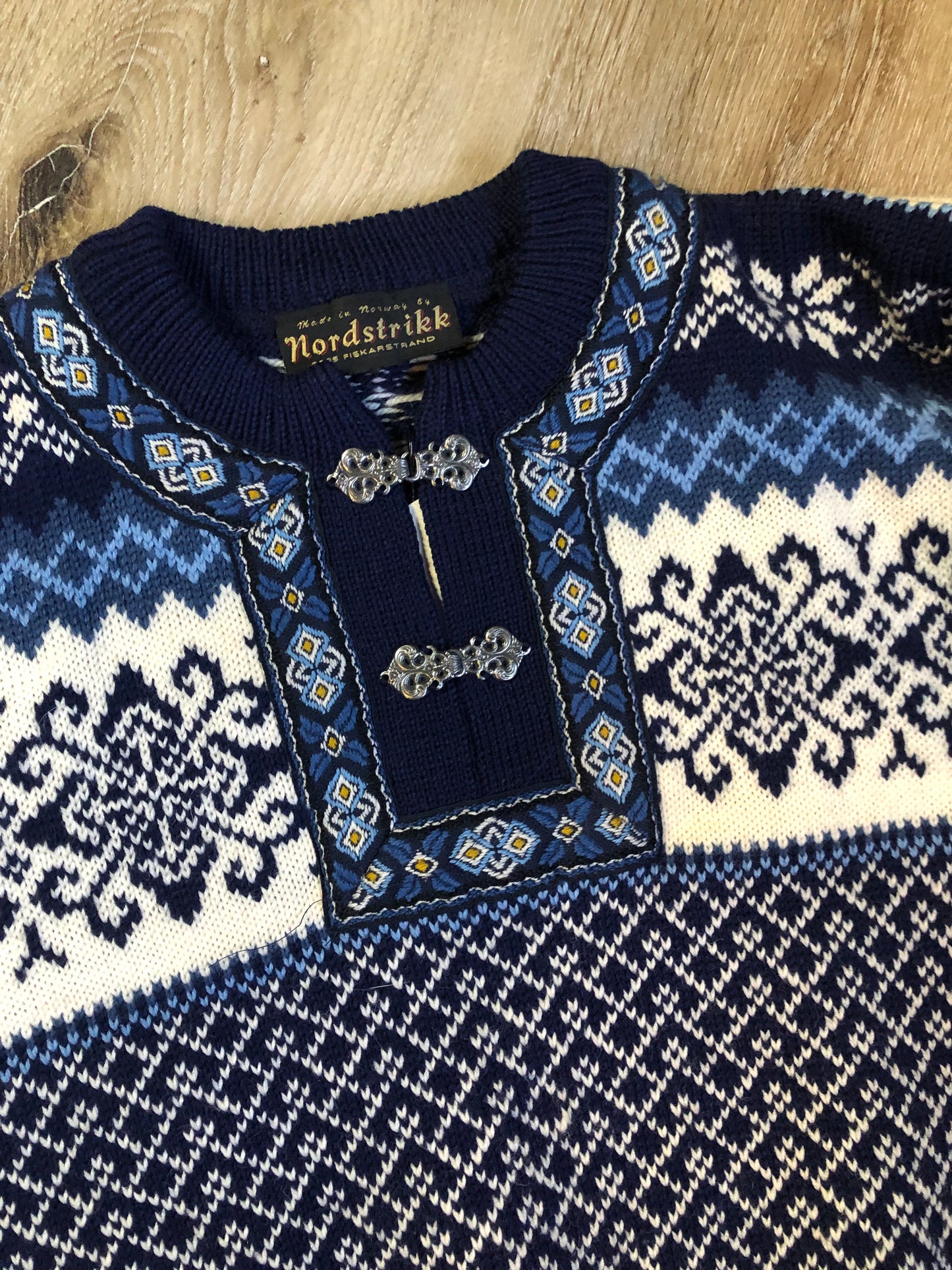 Vintage Nordstrikk 100% wool quarter cut jumper with colourful blue and yellow Norwegian pattern and pewter clasps. Made in Norway - Kingspier Vintage