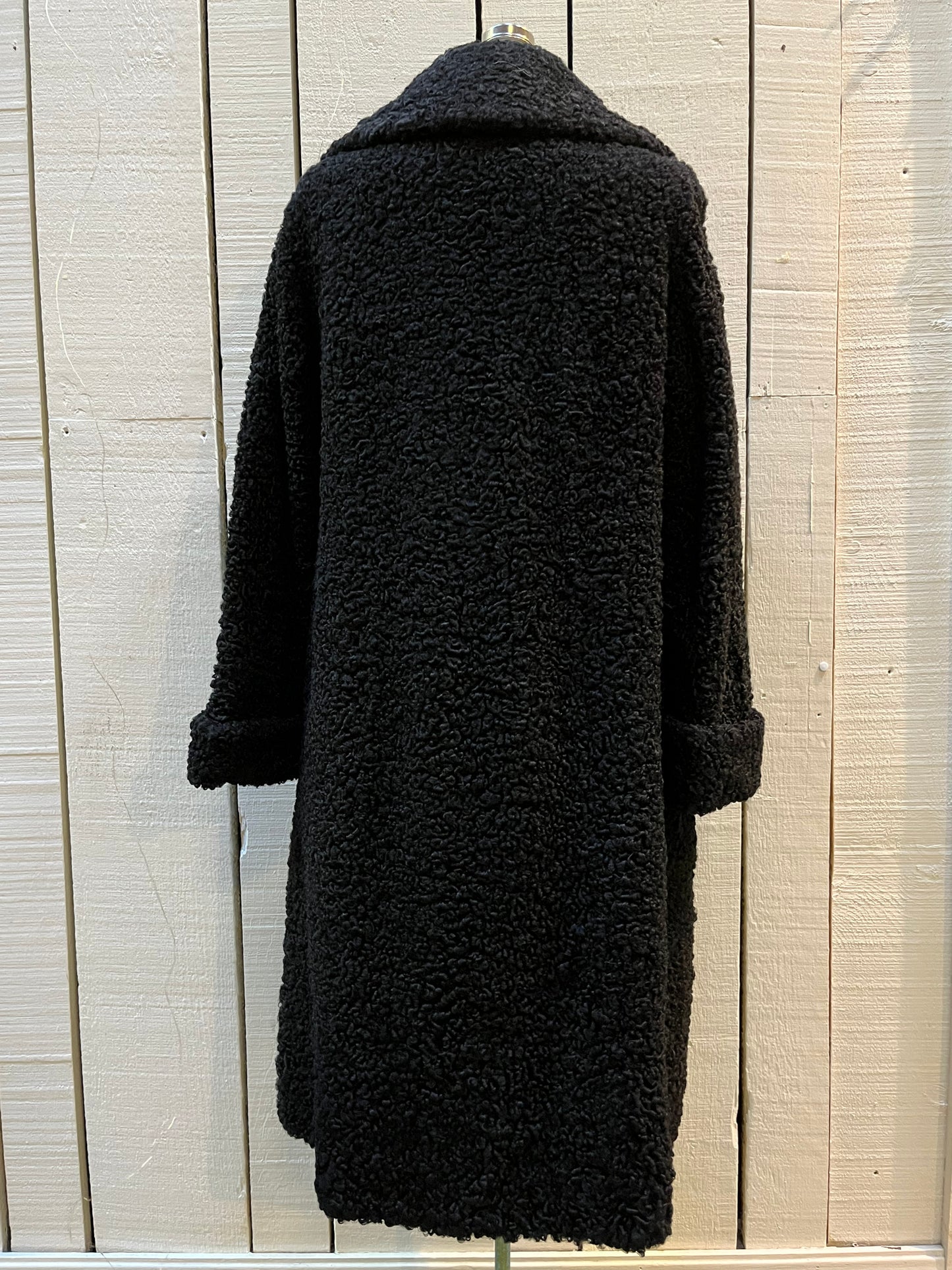 Vintage Maritime Furriers LTD black persian lamb fur coat with two front pockets, button closures and a satin lining with flower motif.
Chest 38”
