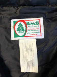 Vintage 1980s Woods down filled anorak jacket in black with nylon shell, front pouch pocket, handwarmer zip pockets, drawstring at the waist and adjustable velcro wrists. Made in Canada. Size XL.