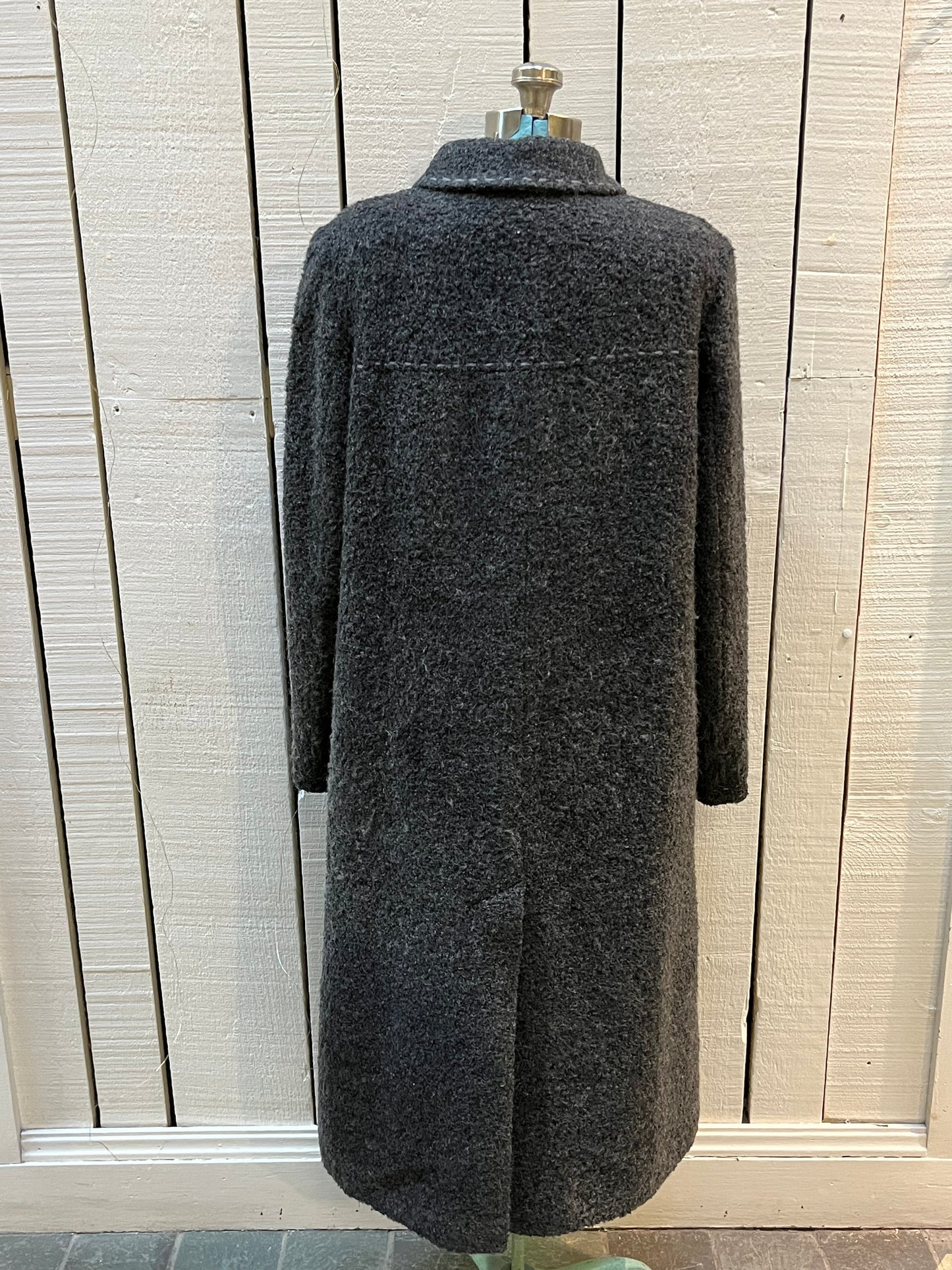 Vintage U-Tex Design long grey wool blend (55% wool/ 25% polyester/ 20% nylon) coat with button closures, two front patch pockets and removable mongolian wool style collar.
Made in Moldova