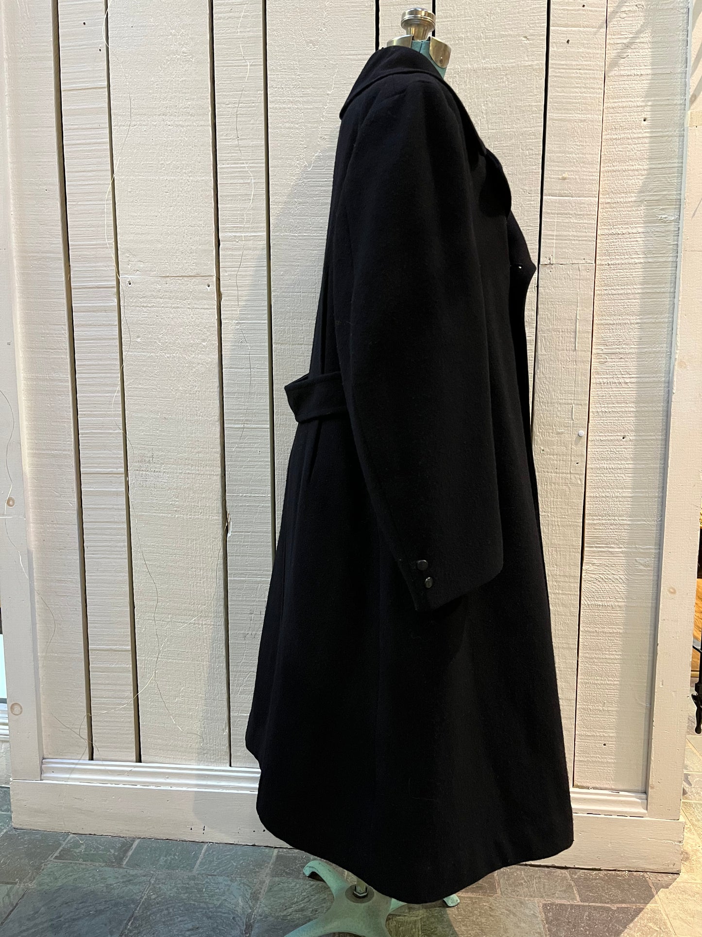 Vintage black 100% wool double breasted long naval uniform coat by Cowell Prince Pants and Clothing Co. with partial lining, two front pockets and two inside pockets.
Size 2, chest 44”