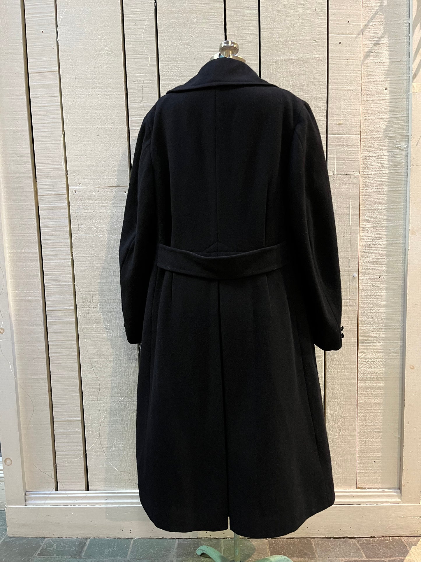 Vintage black 100% wool double breasted long naval uniform coat by Cowell Prince Pants and Clothing Co. with partial lining, two front pockets and two inside pockets.
Size 2, chest 44”