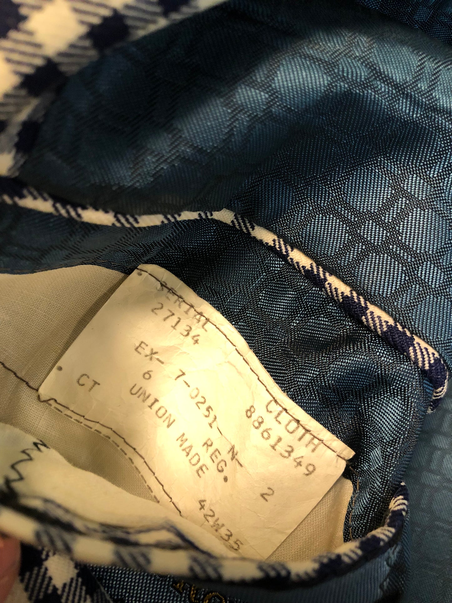 Vintage Saville Row two piece suit in navy and white gingham pattern is union made. Jacket is a two button, notch lapel with two flap pockets in the front, one breast pocket and two inside pockets. Trousers feature a mid rise, wide leg, pressed crease and two front and back pockets.38”x28.5” - Kingspier Vintage