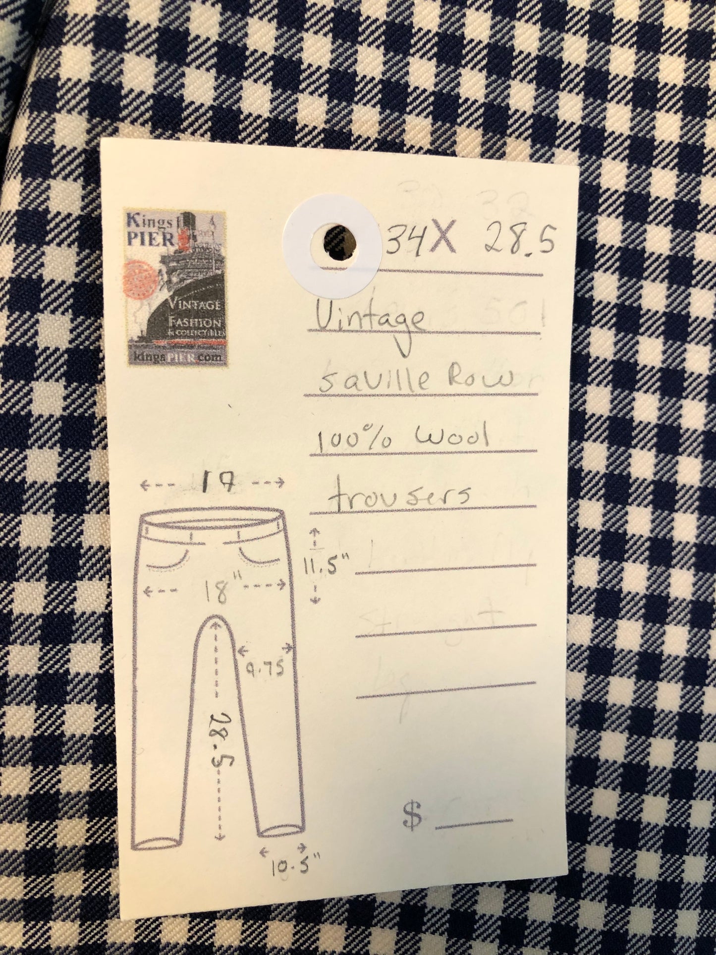 Vintage Saville Row two piece suit in navy and white gingham pattern is union made. Jacket is a two button, notch lapel with two flap pockets in the front, one breast pocket and two inside pockets. Trousers feature a mid rise, wide leg, pressed crease and two front and back pockets.38”x28.5” - Kingspier Vintage