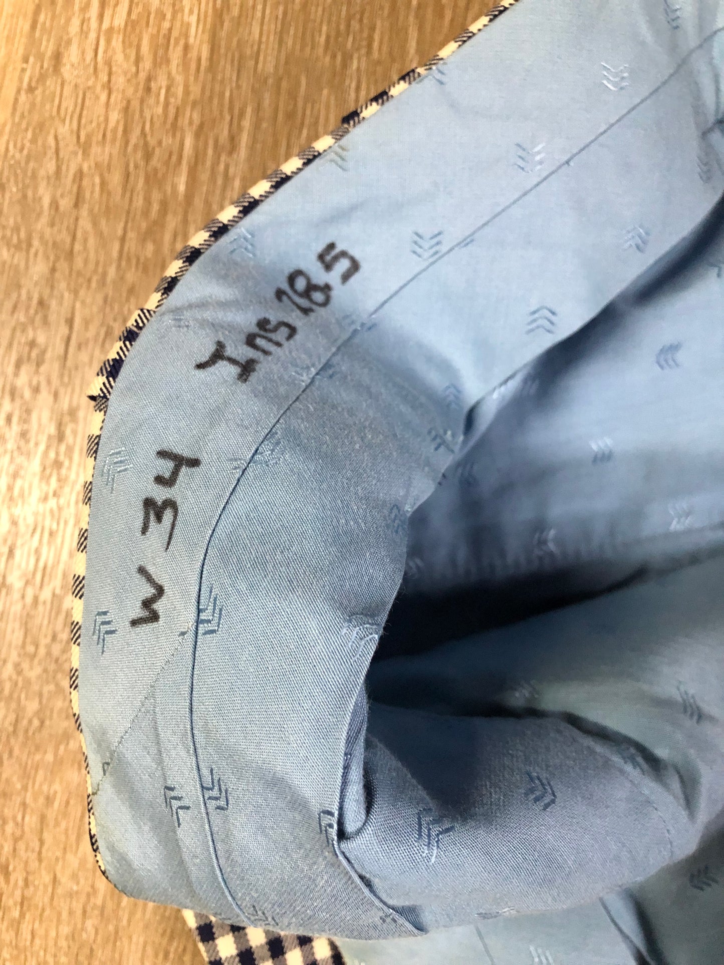 Vintage Saville Row two piece suit in navy and white gingham pattern is union made. Jacket is a two button, notch lapel with two flap pockets in the front, one breast pocket and two inside pockets. Trousers feature a mid rise, wide leg, pressed crease and two front and back pockets.38”x28.5” - Kingspier Vintage