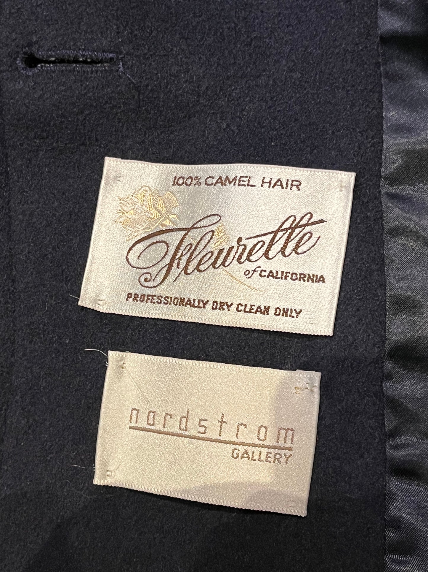 Vintage Fleurette of California from Nordstrom navy double breasted 100% camel hair coat with flap pockets.
Union Made in USA
Chest 41”