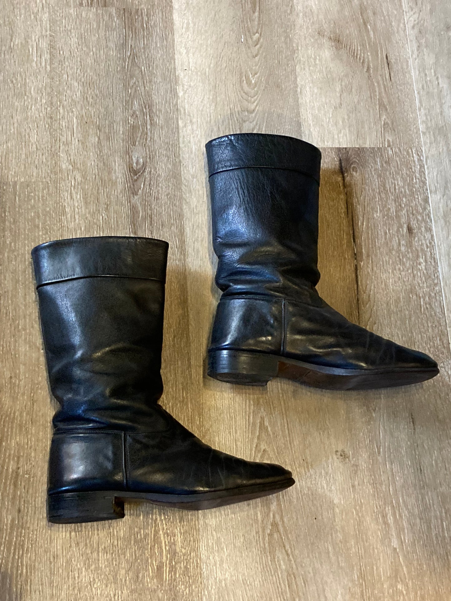 Vintage calf height black leather boots circa 1960. Leather lined with leather soles. Size 10M, 12W US, 43 EUR