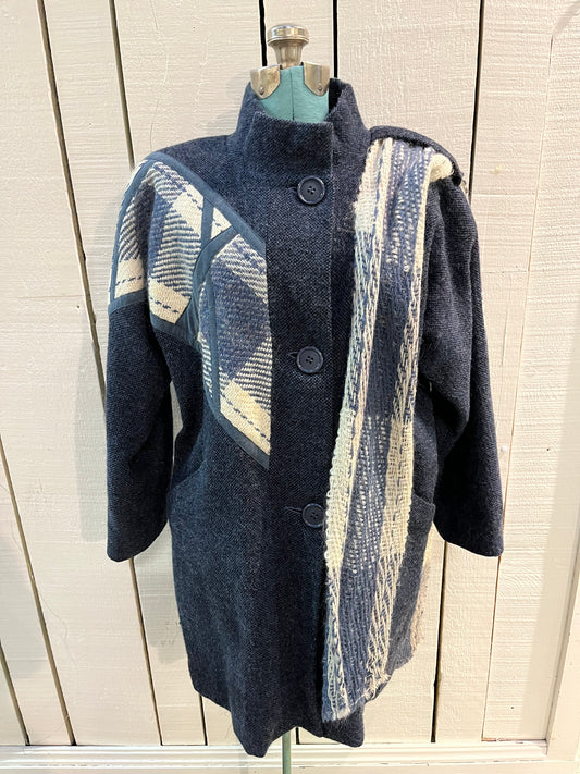 Vintage Epsilon blue and white 100% pure virgin wool coat with attached scarf, button closures and two front pockets.
Made in Canada
Size 10