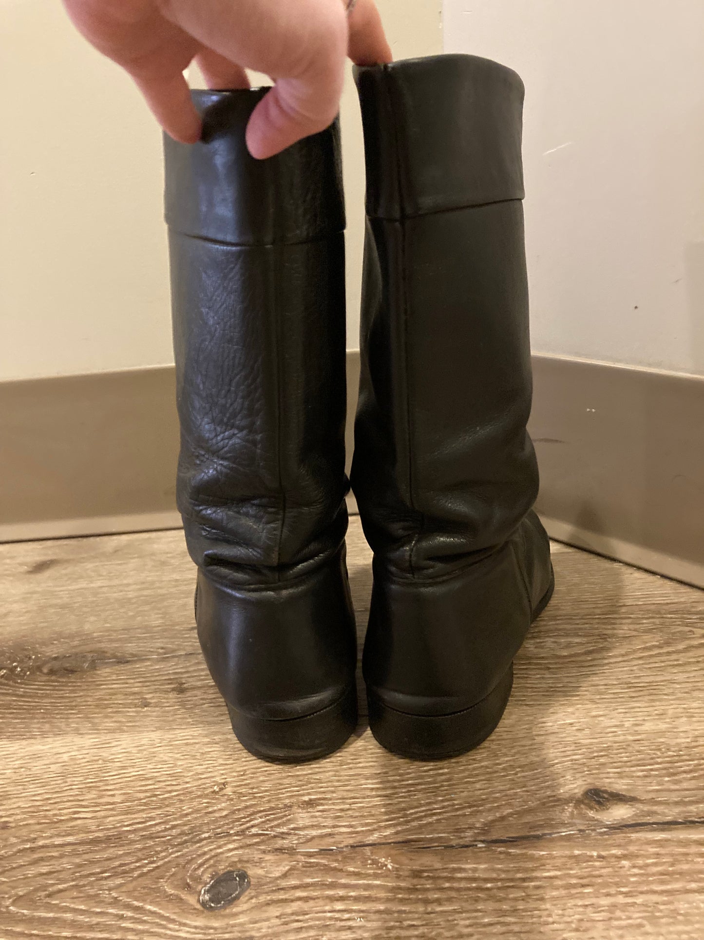 Vintage calf height black leather boots circa 1960. Leather lined with leather soles. Size 10M, 12W US, 43 EUR