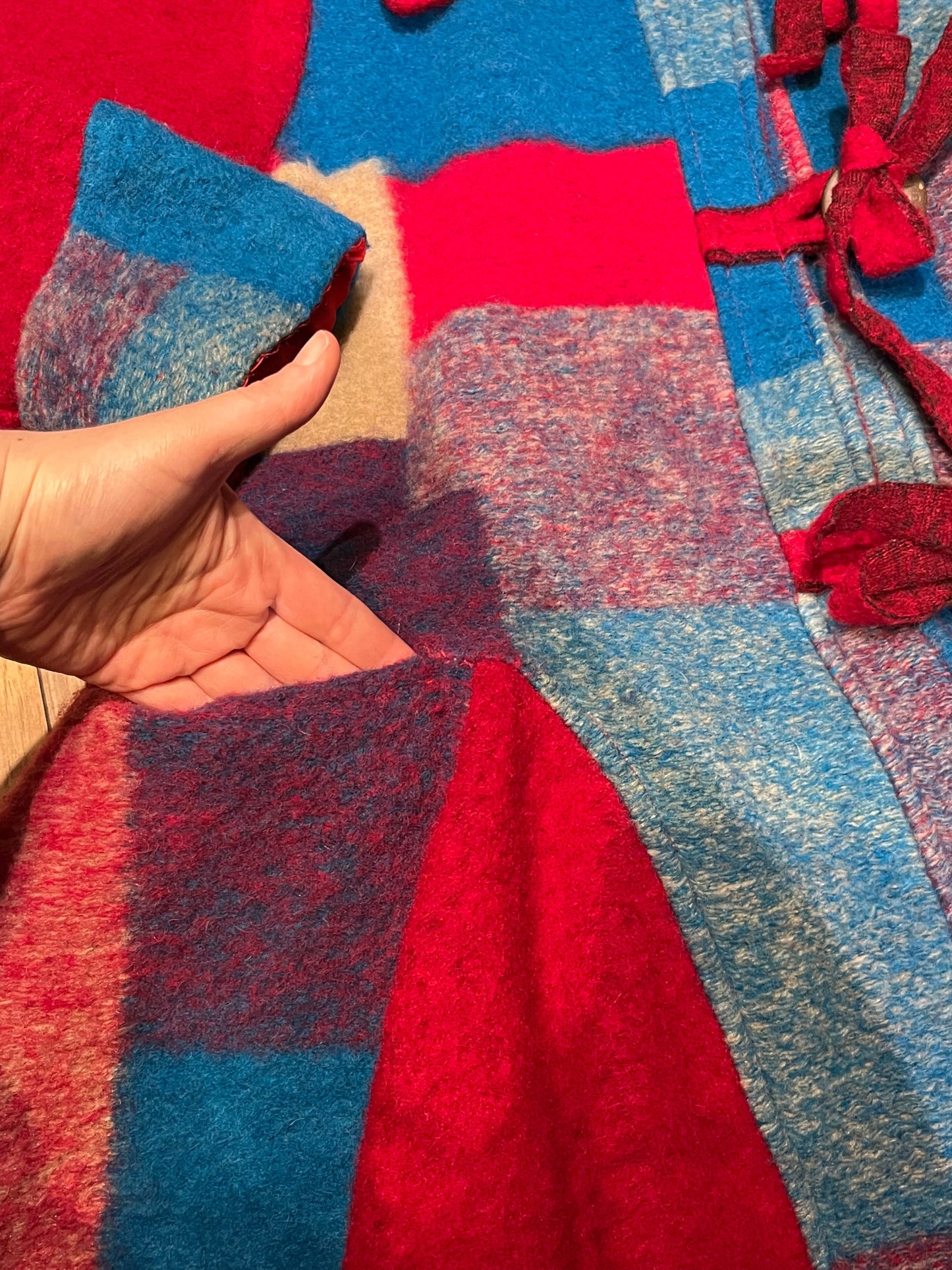 Red and blue wool blend (80% wool/ 20%) patch work coat with matching scarf, toggle closures and two front pockets.
Made in Italy
Chest 43”