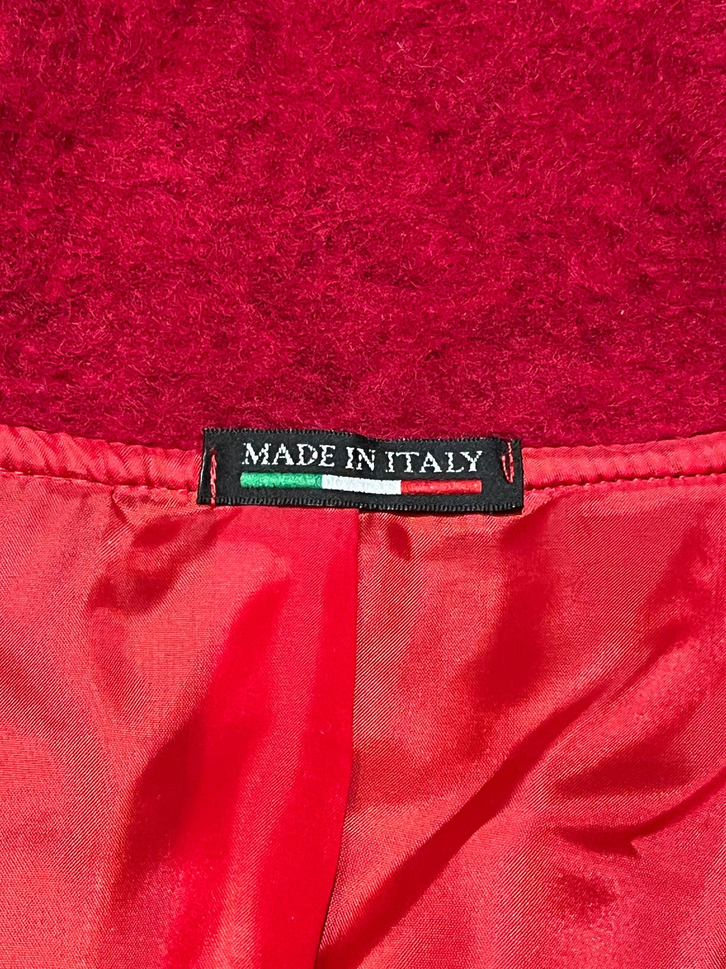 Red and blue wool blend (80% wool/ 20%) patch work coat with matching scarf, toggle closures and two front pockets.
Made in Italy
Chest 43”