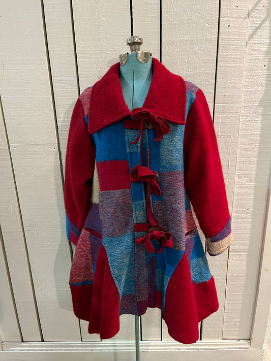 Red and blue wool blend (80% wool/ 20%) patch work coat with matching scarf, toggle closures and two front pockets.
Made in Italy
Chest 43”