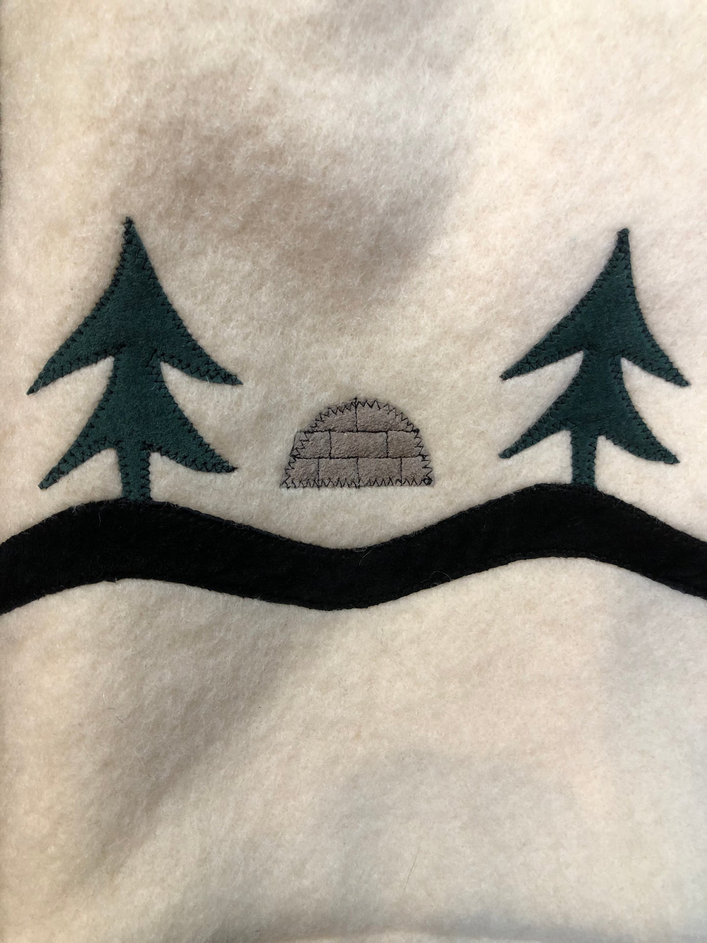 Kingspier Vintage - Hudson’s Bay Company white pure virgin wool northern parka featuring a hood with fox fur trim, zipper closure, quilted lining, inside drawstring, slash pockets, hidden knit cuffs and tree a nd igloo design suede appliqué on the front and back. Made in Canada. Size 14/ large.