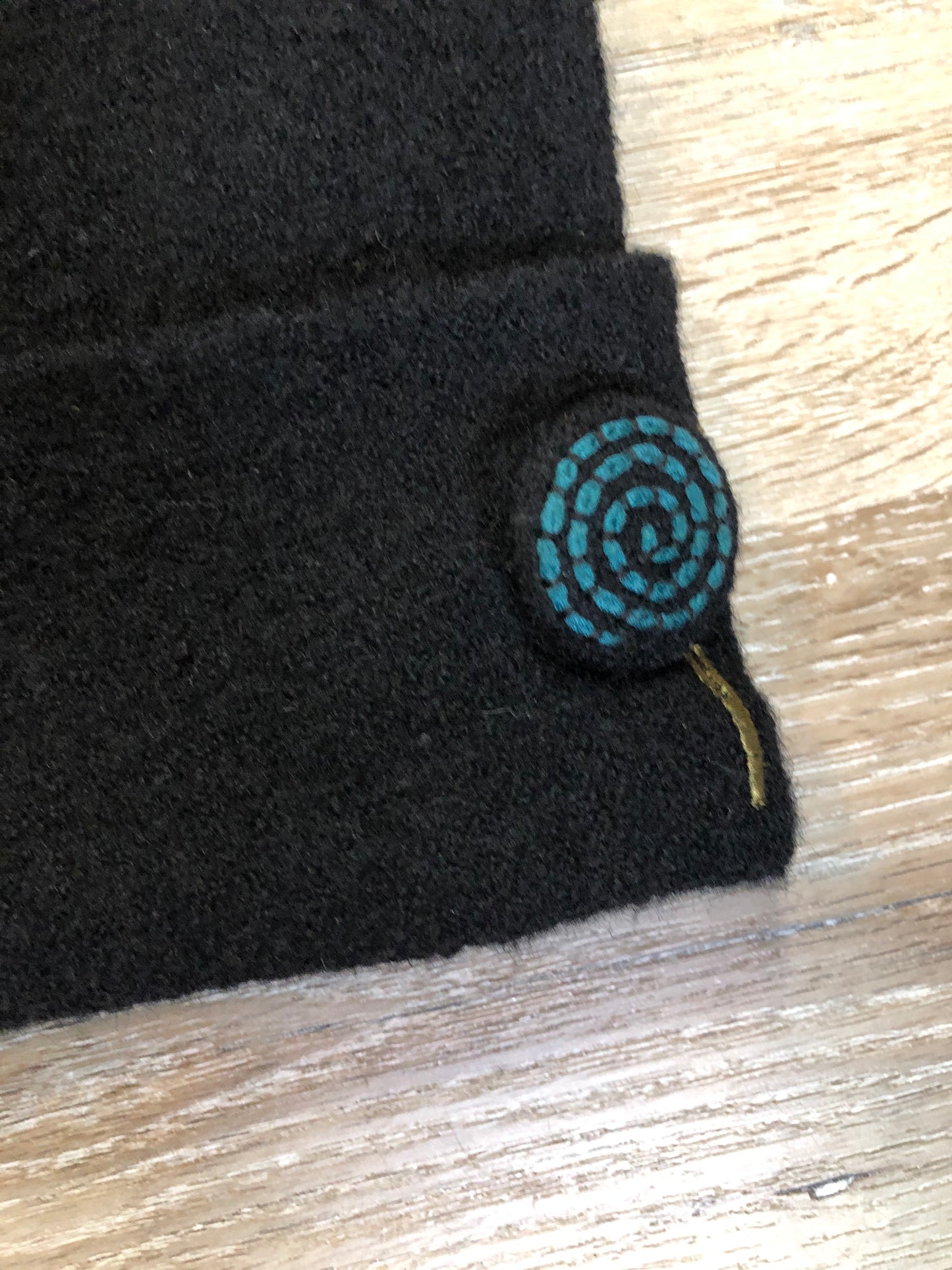 Kingspier Vintage - CoVelo Clothing black wool jacket with flower embellishments. Snap closures, side pockets and embroidered swirl decorative buttons. Size large.