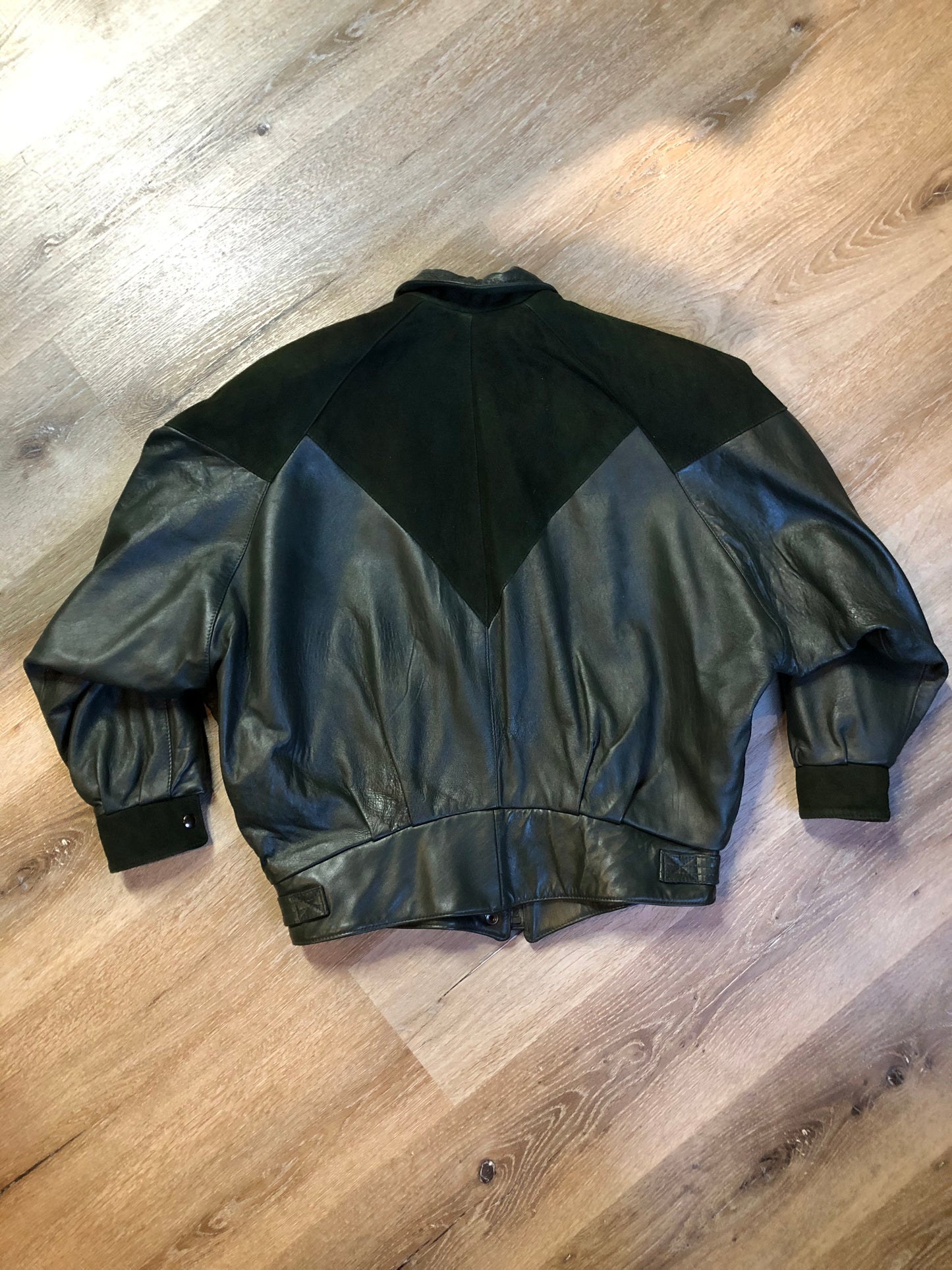 Kingspier Vintage - Bainton green leather jacket with green suede details, zipper and snap closures, slash pockets and black lining. Made in Canada. Size large.