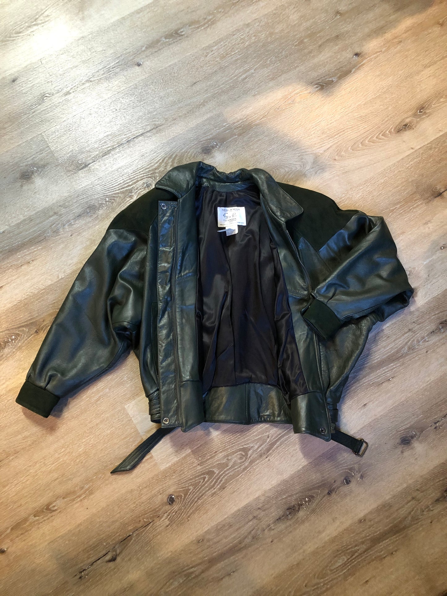 Kingspier Vintage - Bainton green leather jacket with green suede details, zipper and snap closures, slash pockets and black lining. Made in Canada. Size large.