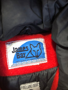 Vintage James Bay 100% virgin wool northern parka in bright red. This parka features a white fur trimmed hood, zipper closure, patch pockets, quilted lining, storm cuffs, embroidery details and northern fishing scene in felt applique. Made in Canada - Kingspier Vintage