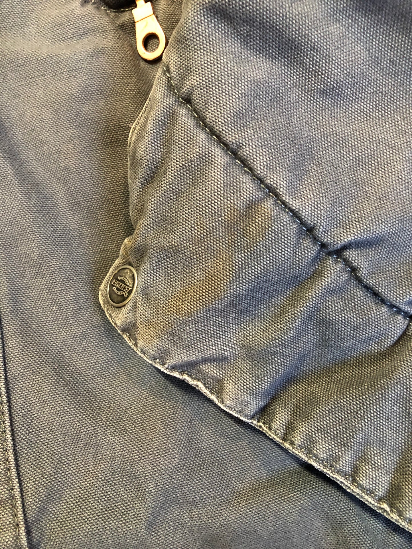 Kingspier Vintage - Dickie’s grey insulted chore jacket with grey corduroy collar, zipper closure, slash pockets, one zip pocket on the chest, one inside pocket and bright orange quilted lining. Size large.