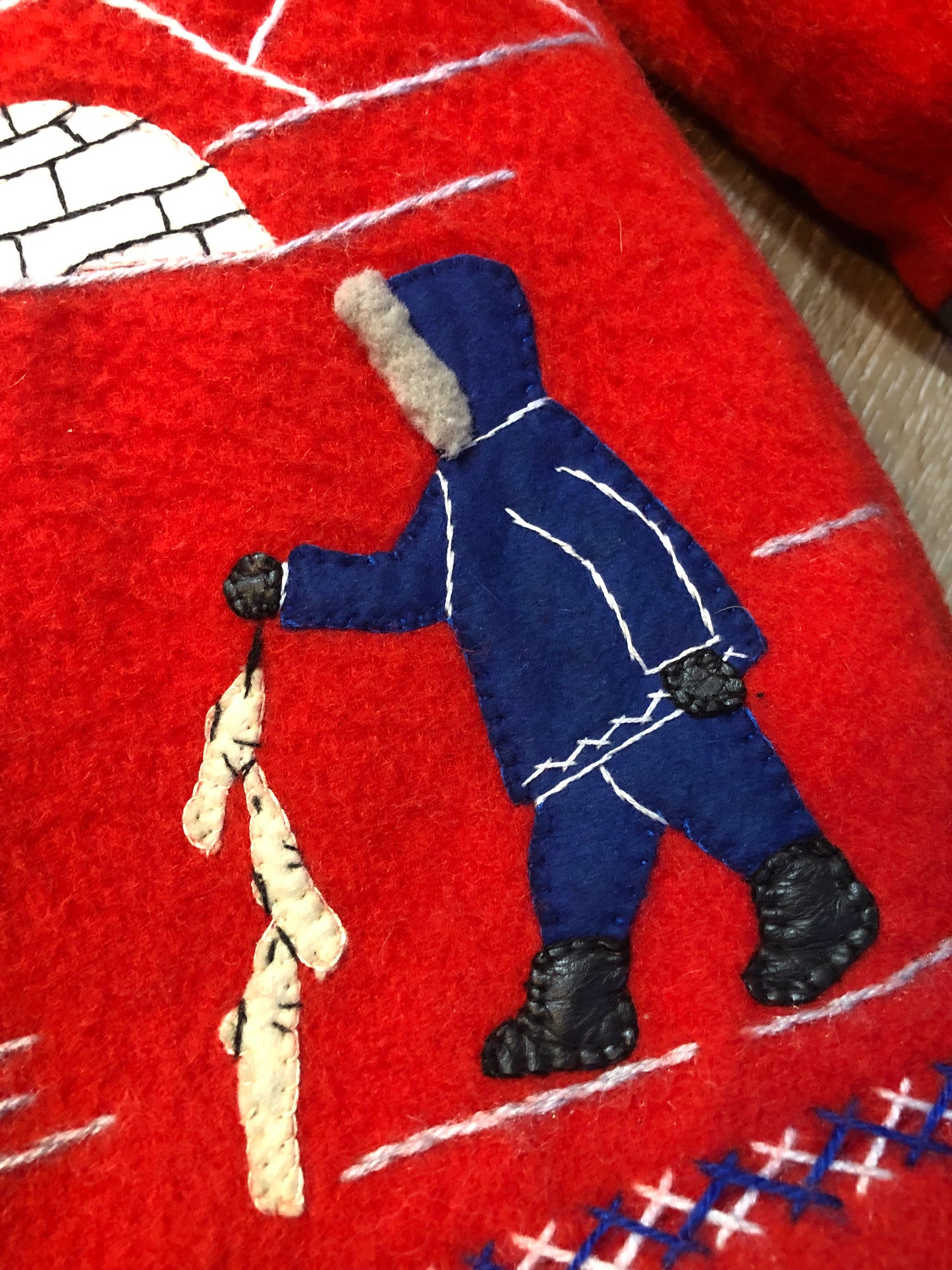 Vintage James Bay 100% virgin wool northern parka in bright red. This parka features a white fur trimmed hood, zipper closure, patch pockets, quilted lining, storm cuffs, embroidery details and northern fishing scene in felt applique. Made in Canada - Kingspier Vintage