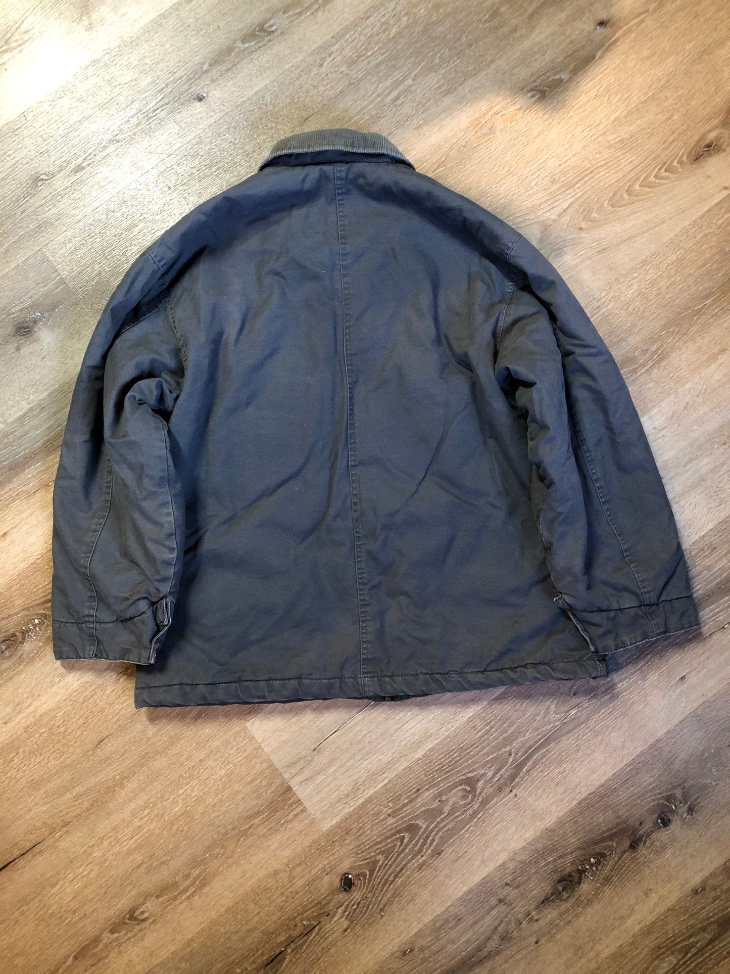 Kingspier Vintage - Dickie’s grey insulted chore jacket with grey corduroy collar, zipper closure, slash pockets, one zip pocket on the chest, one inside pocket and bright orange quilted lining. Size large.