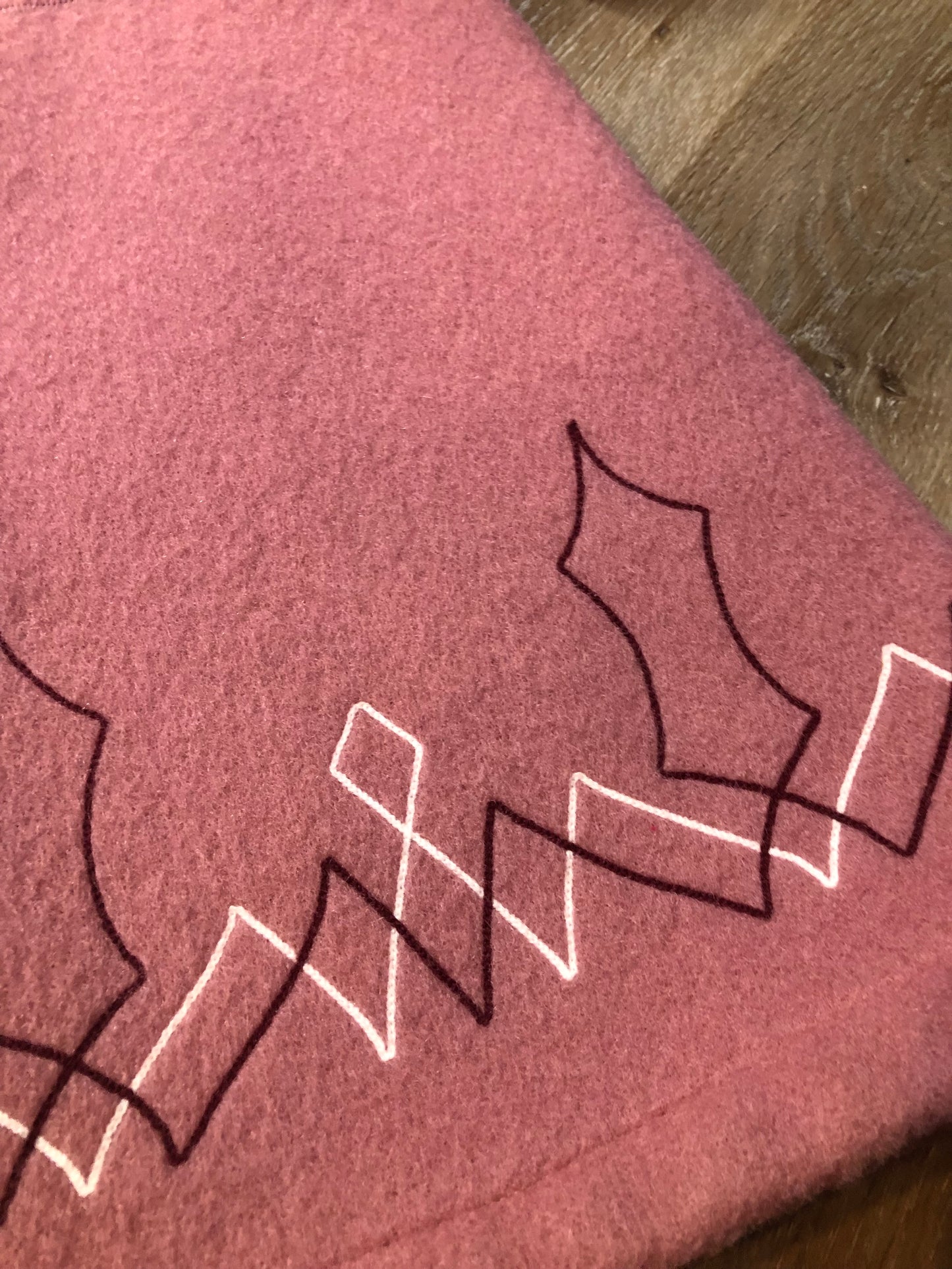 Vintage Hudson’s Bay Company pink 100% virgin wool parka with white fur trimmed hood, fur pom poms, zipper closure, patch pockets, satin lining and embroidered pattern along the hem. Made in Canada. Size 14 - Kingspier Vintage